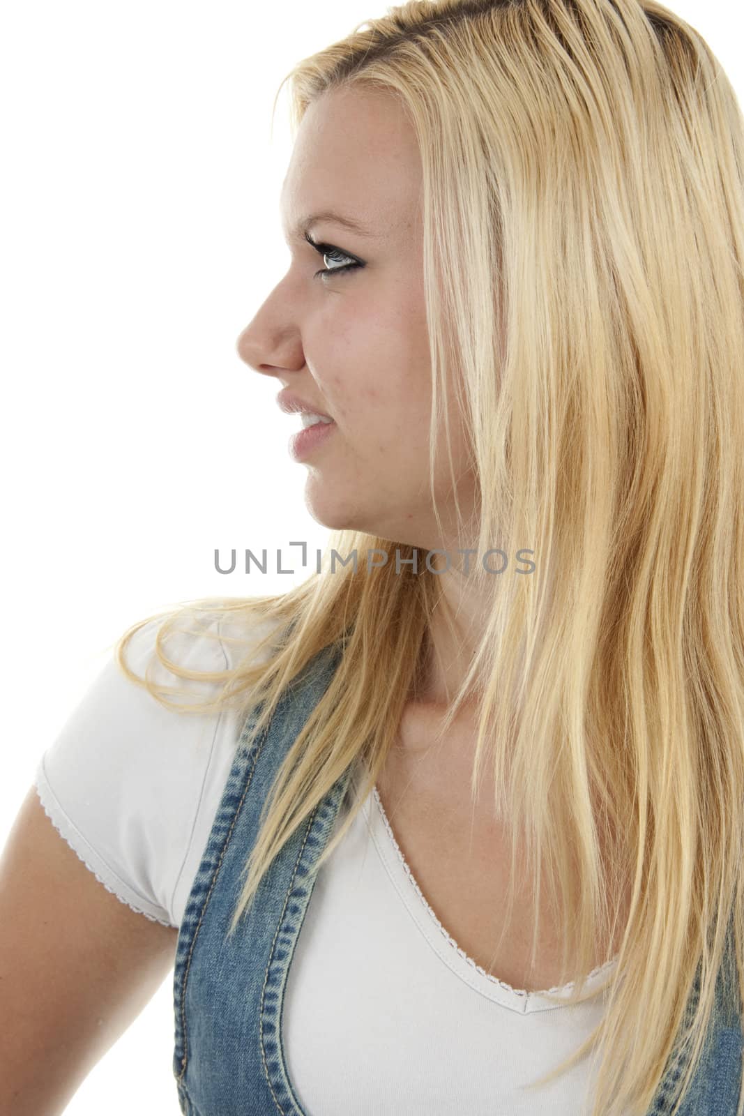 Young blonde woman is posing over white background