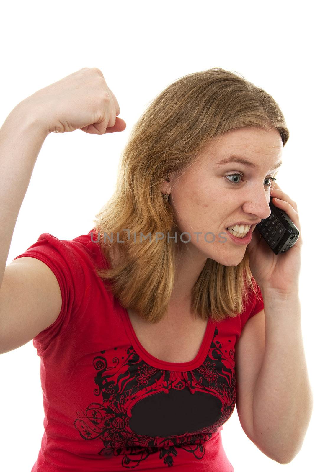 Young woman is angry on the phone over white background