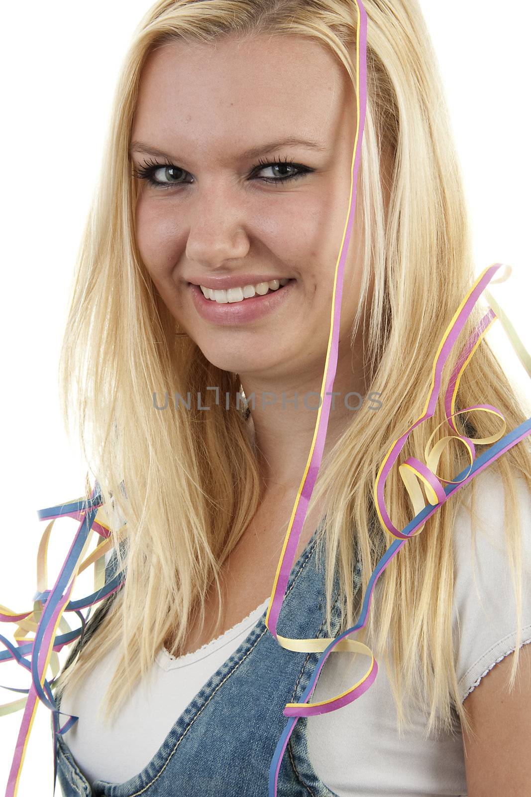 Birthday girl with party streamers over white background