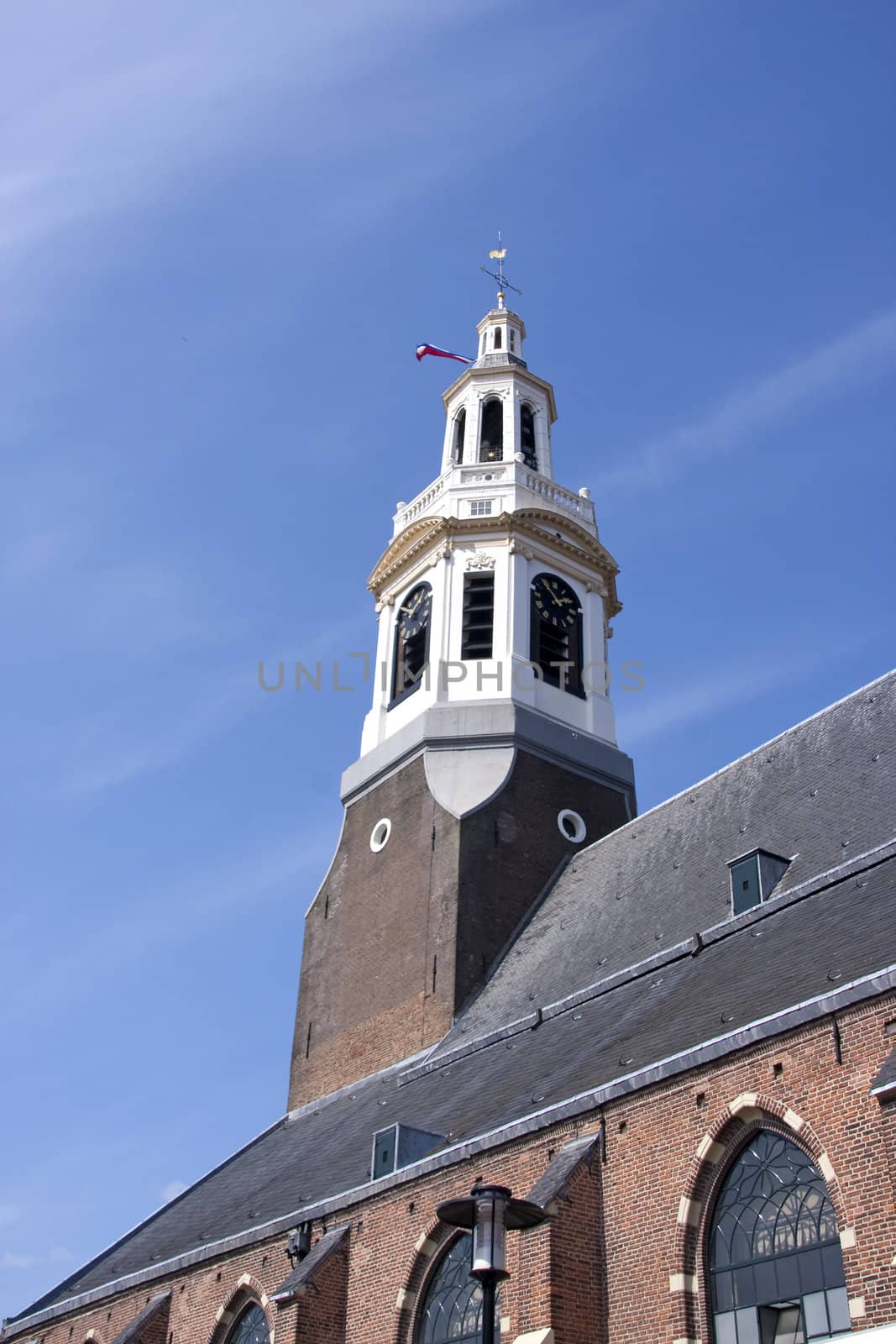 Tower of the big churg in Nijkerk, the Netherlands, against blue sky