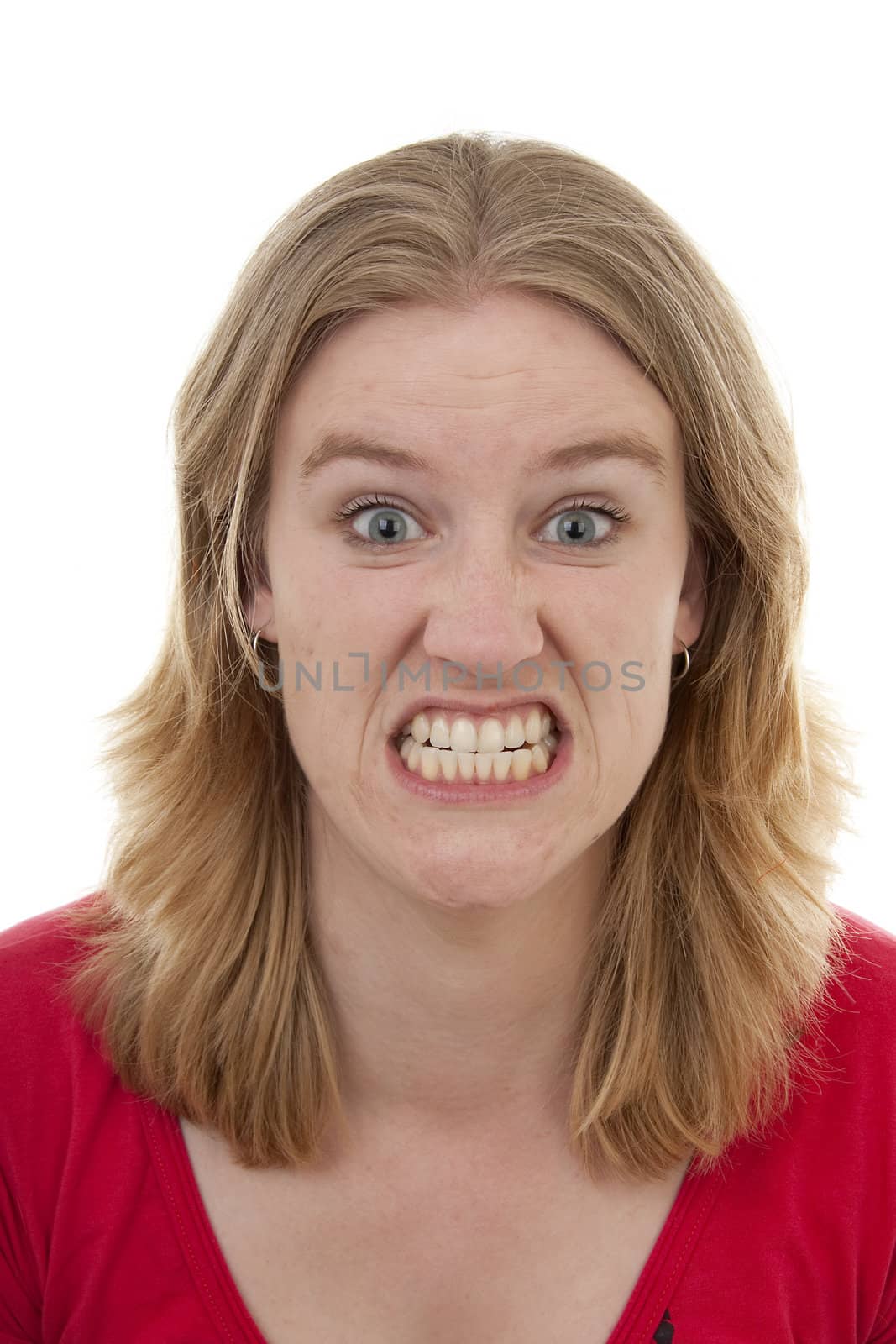 Woman looks very angry in closeup over white background