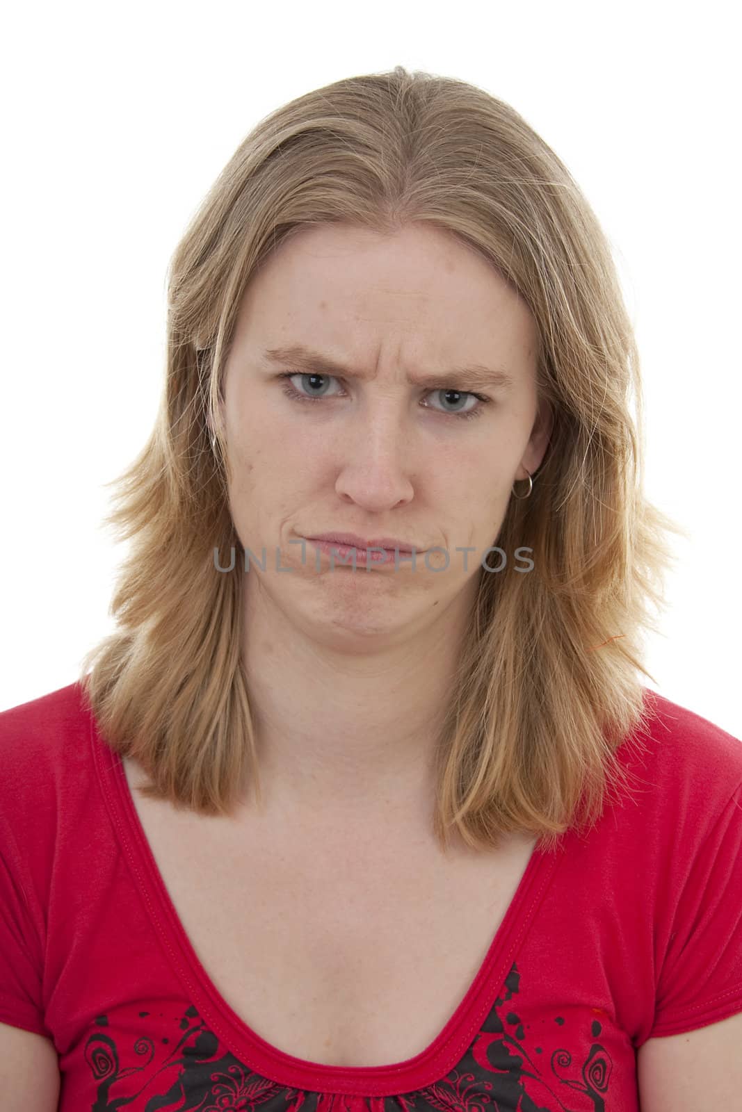 Woman looks angry in closeup over white background