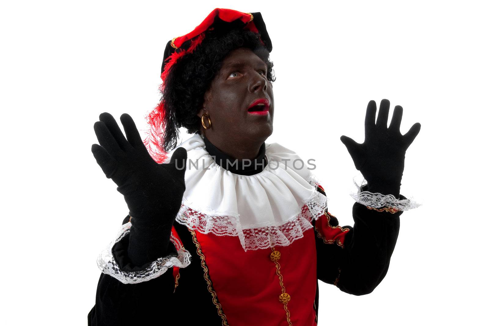 surprised Zwarte piet ( black pete) typical Dutch character part of a traditional event celebrating the birthday of  Sinterklaas in december over white background
