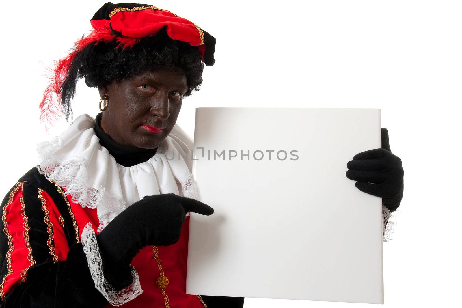 Zwarte piet ( black pete) typical Dutch character part of a traditional event celebrating the birthday of  Sinterklaas in december over white background is holding empty text board