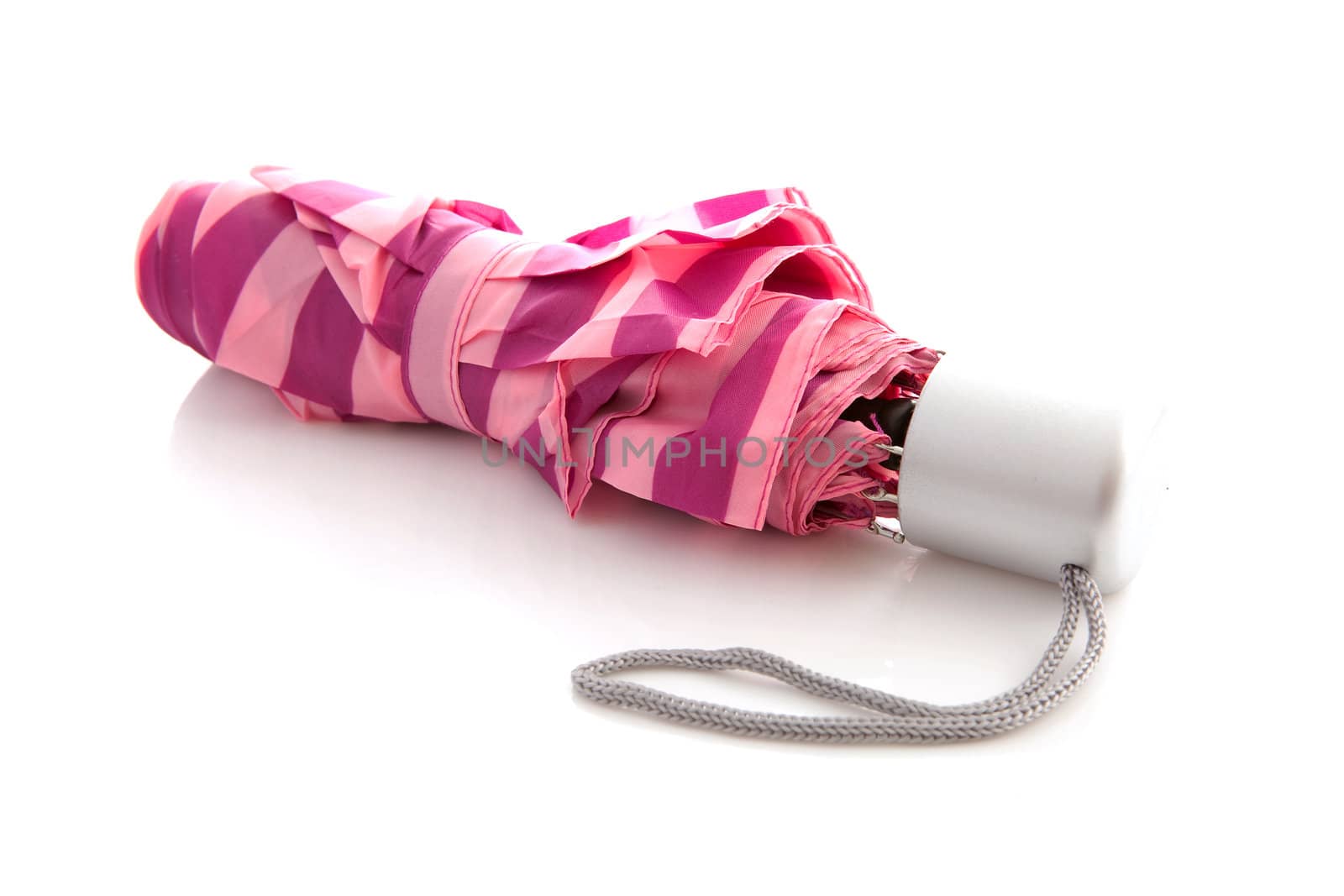 Little pink umbrella isolated on white background