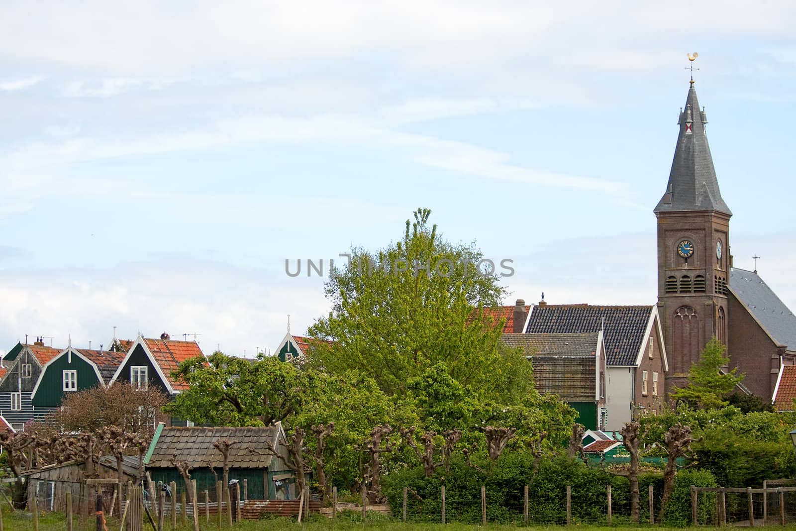 typical view of Dutch houses and church of the village Marken