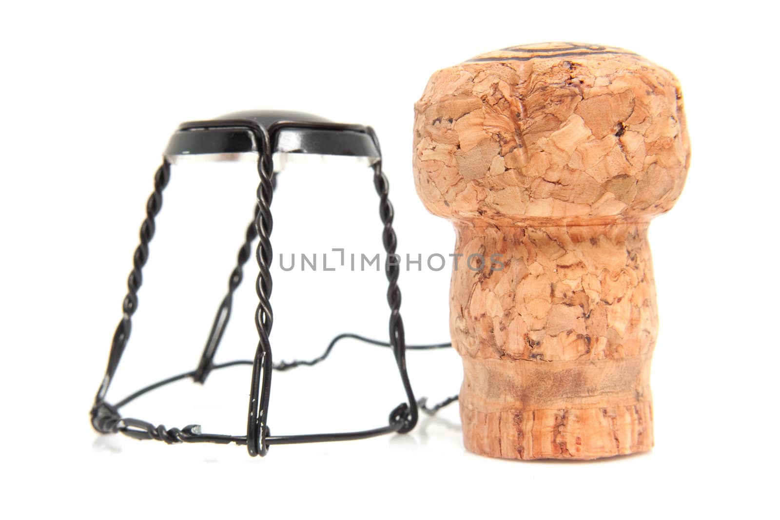Champagne cork in closeup over white background
