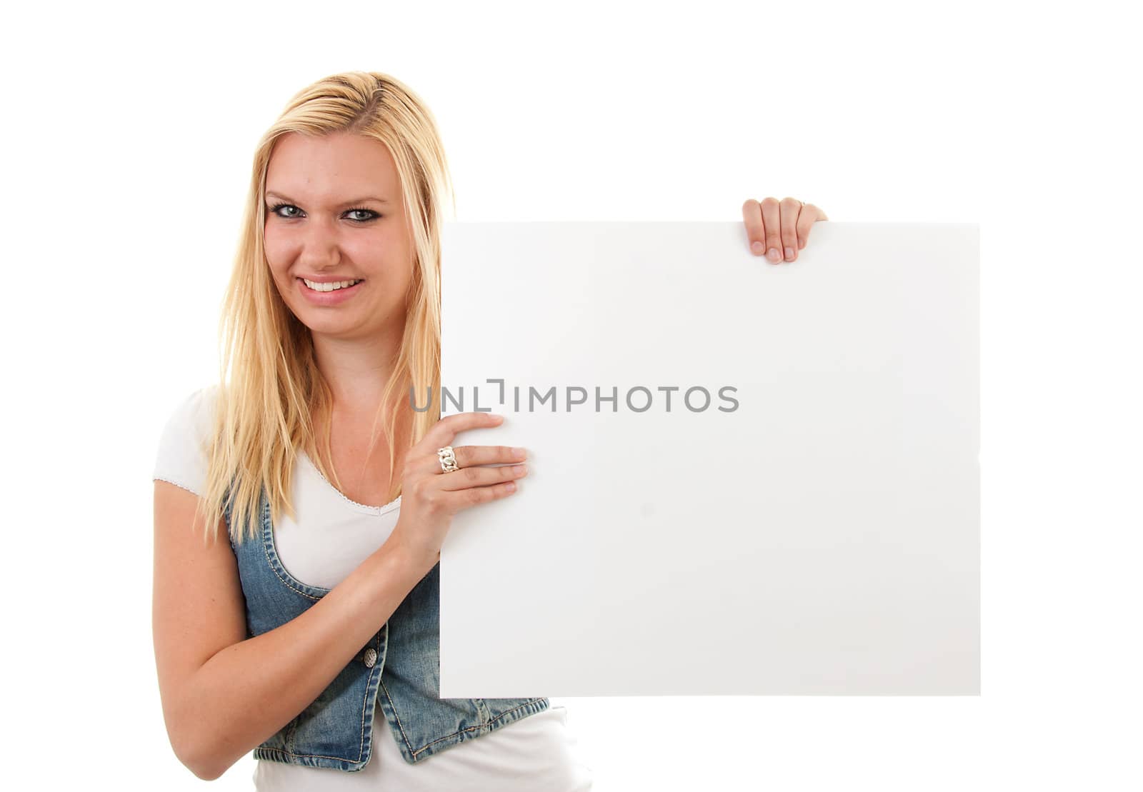 Young blonde woman is holding empty text board over white background