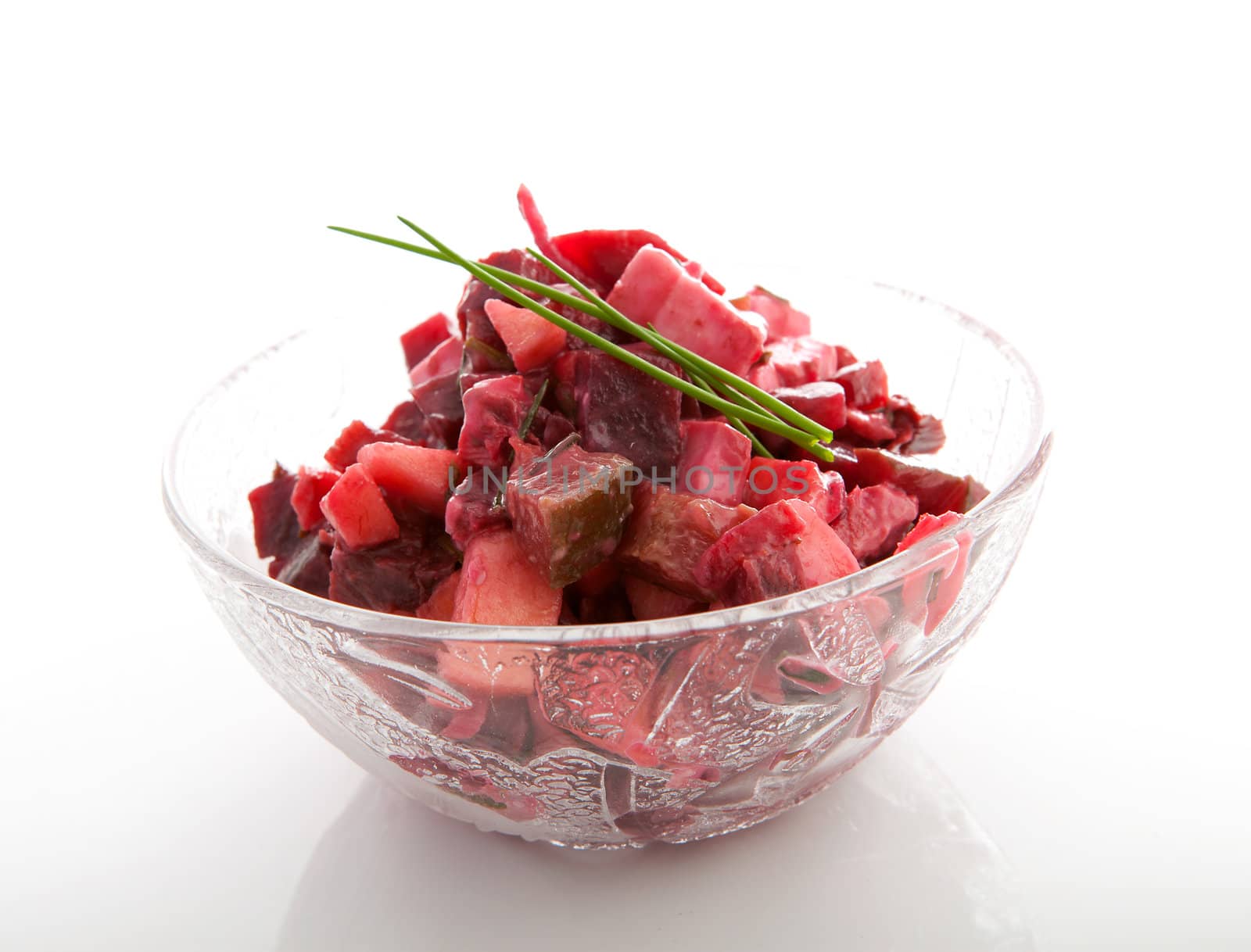 Bowl with beet salad isolated on white background