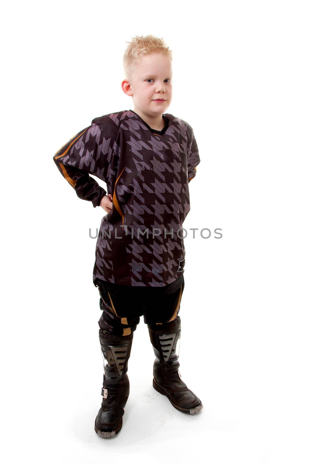Young motor race boy is posing over white background