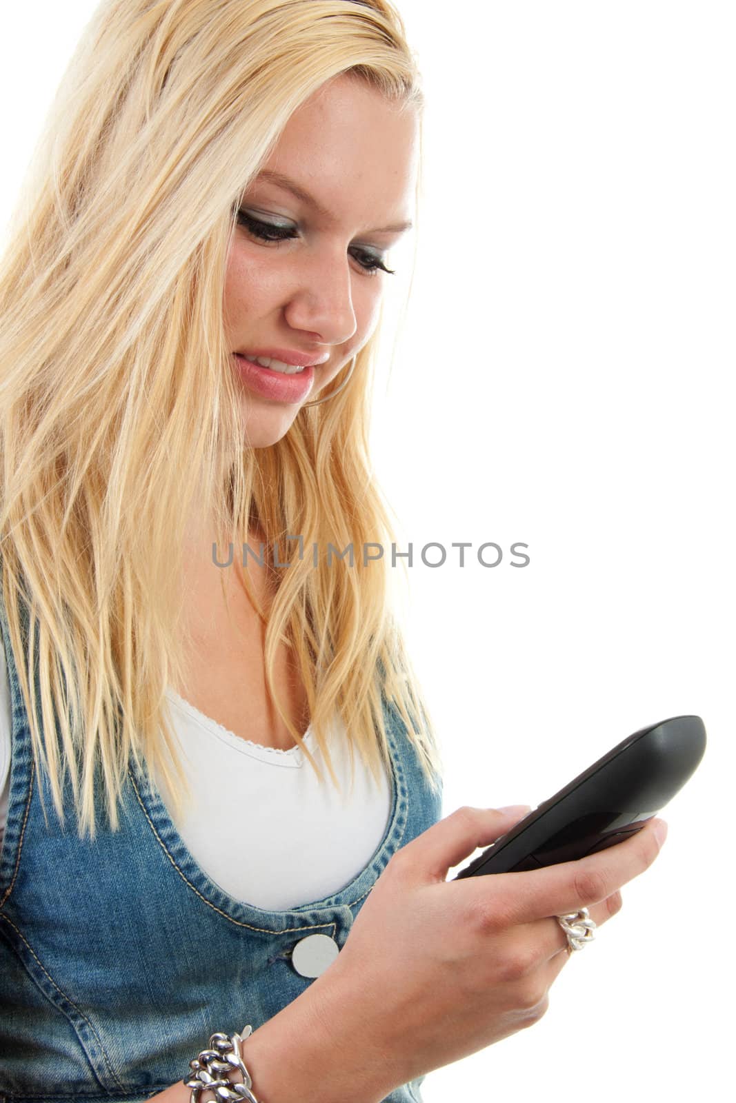 Young blonde woman is dialing on the phone over white background