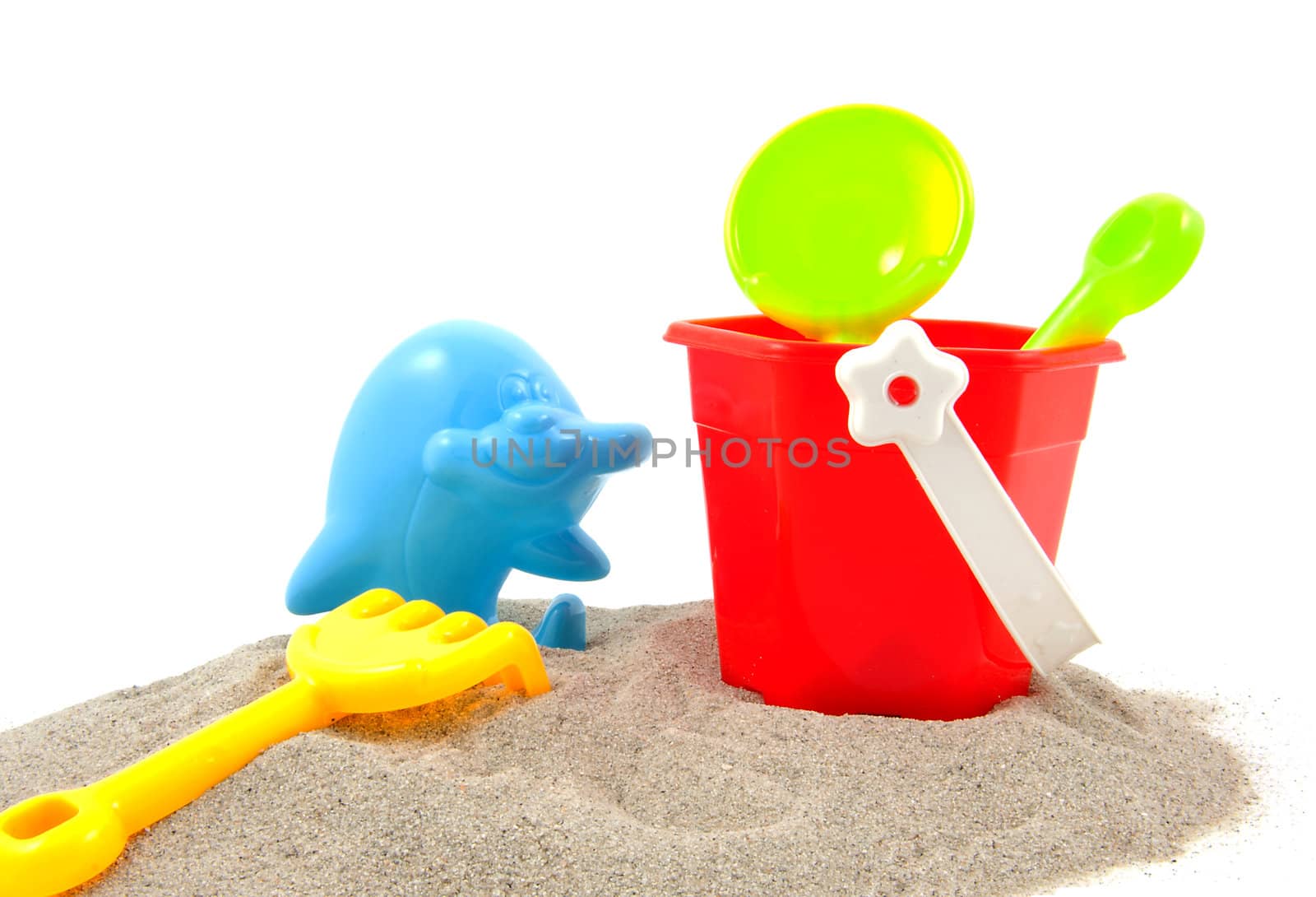 Colorful play toys for the beach over white background