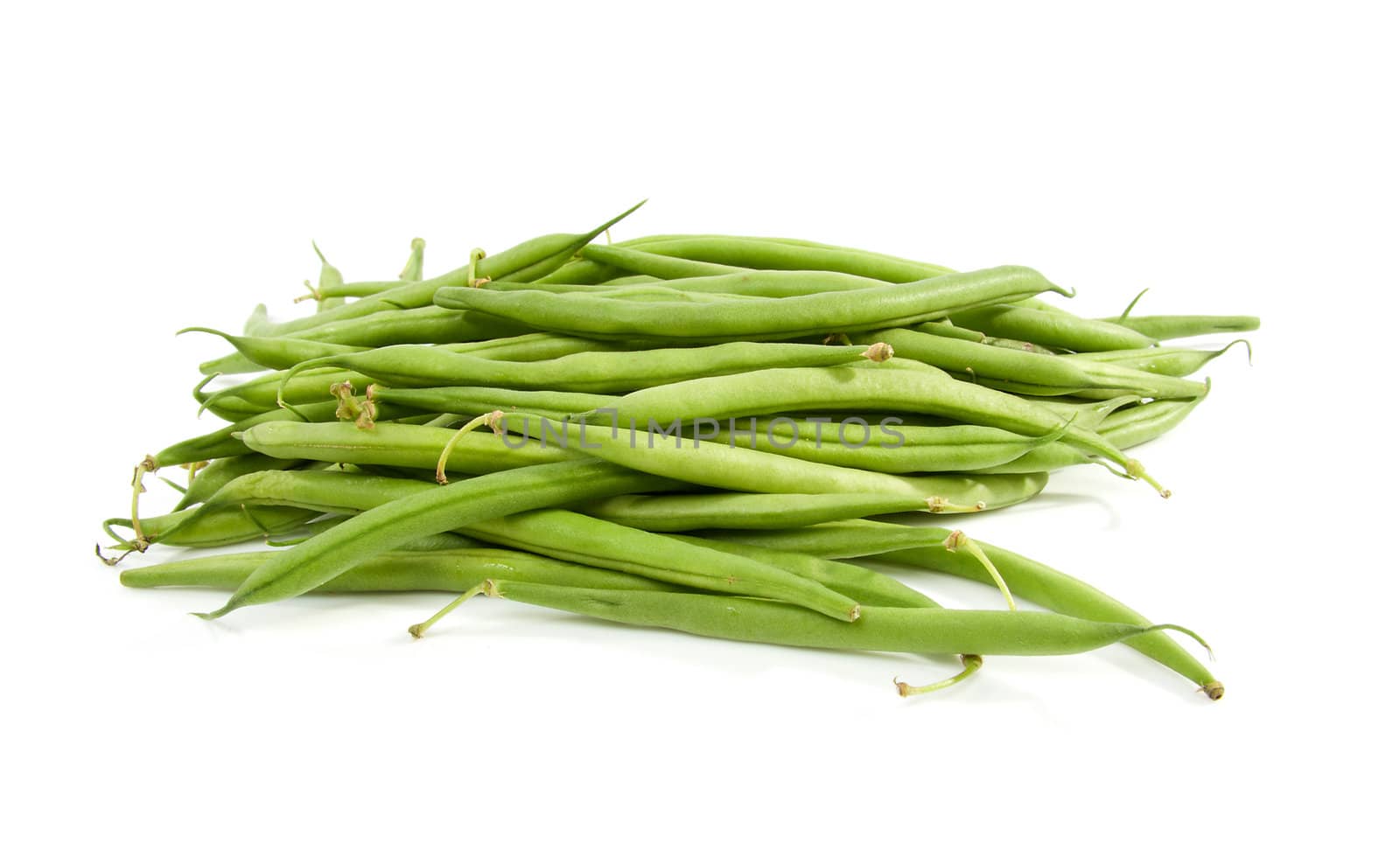 raw long green beans over white background