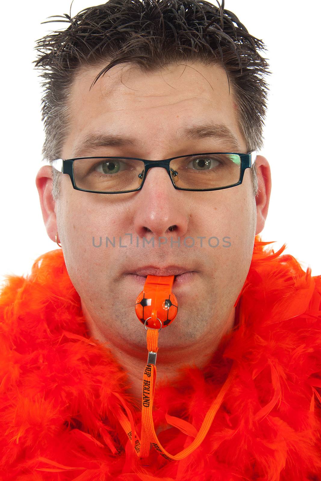 Dutch soccer supporter in orange outfit with flute over white background