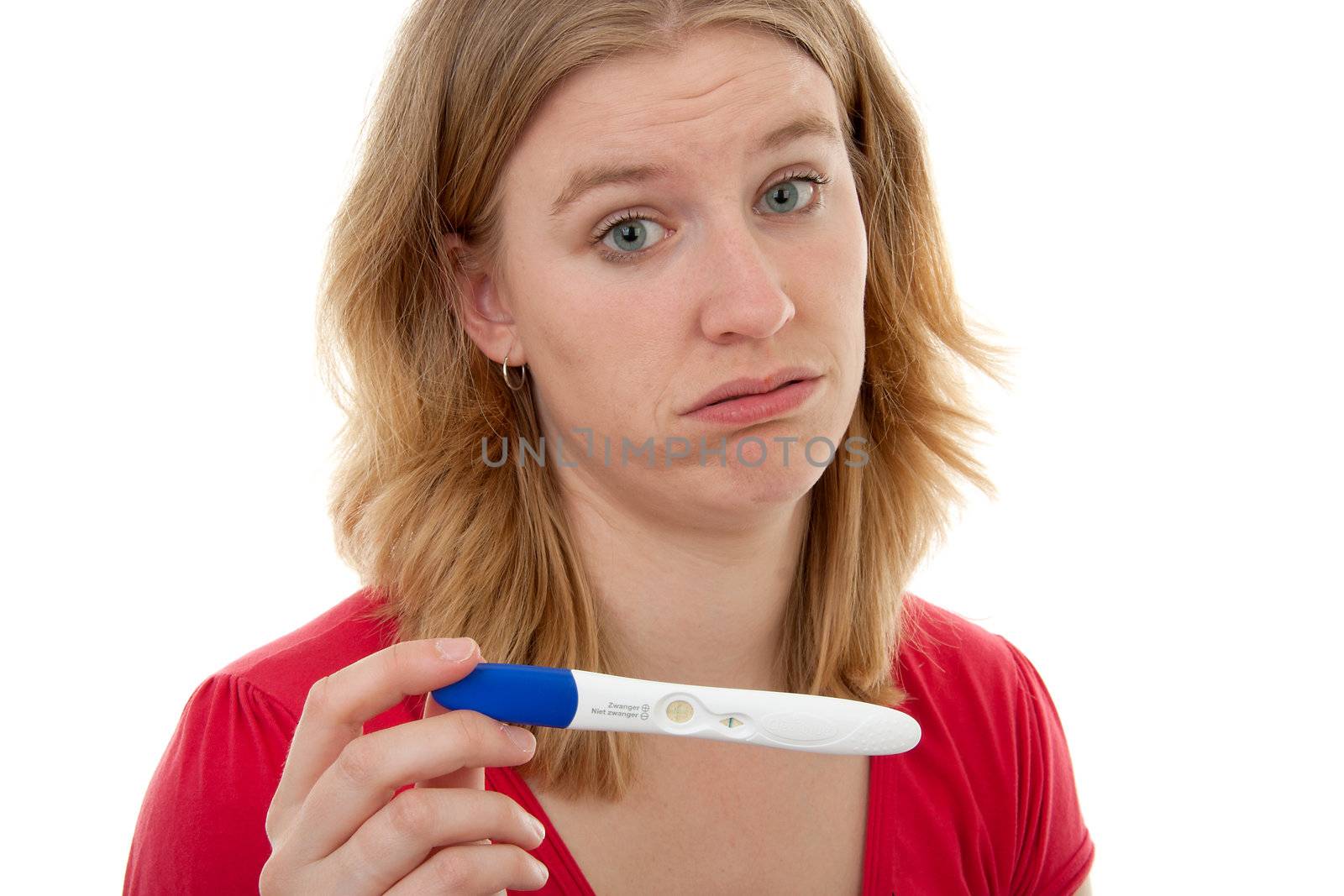 woman in despair, she is pregnant again and shows her test over white background