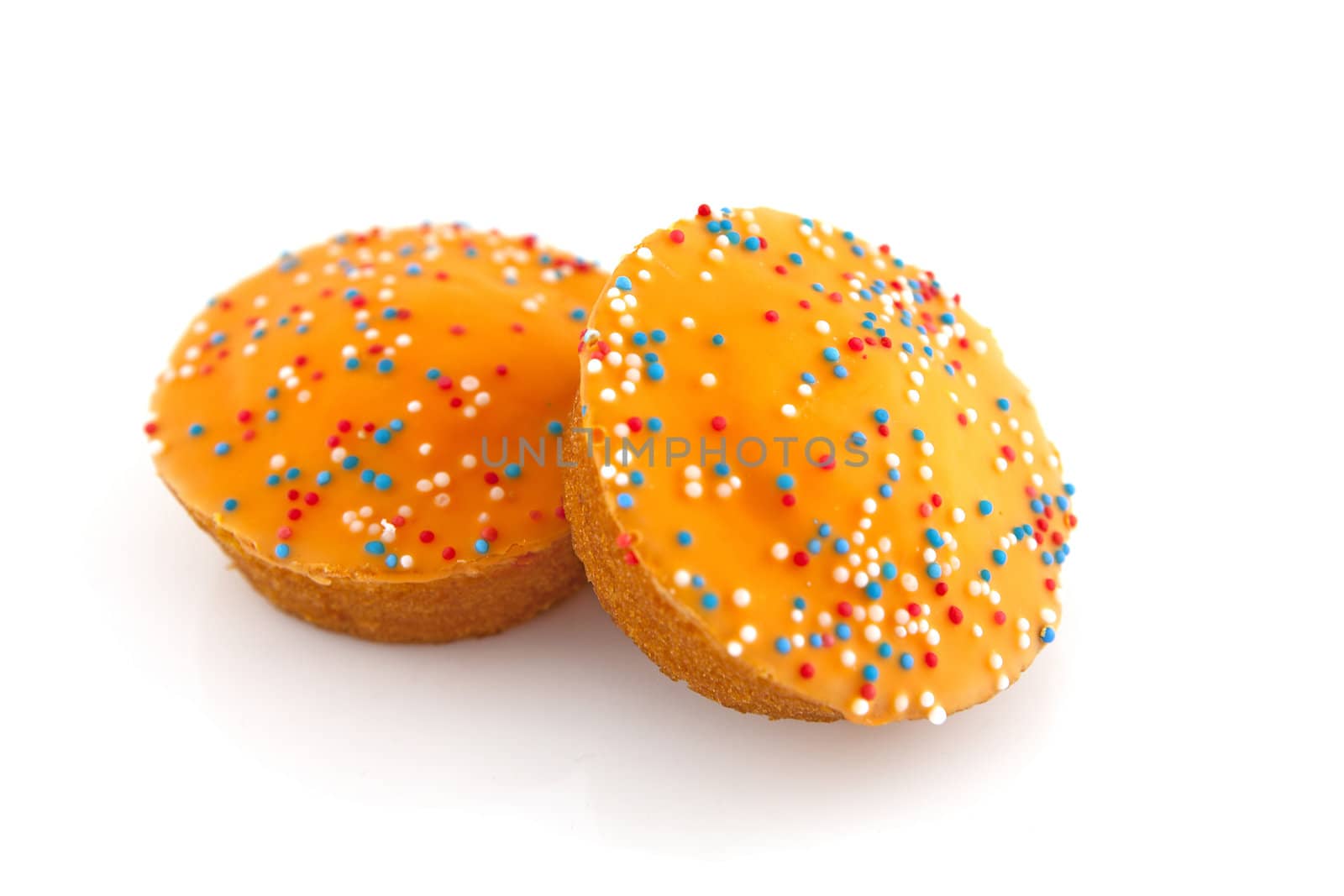 Big orange cake cookies for Dutch soccer with confetti over white background