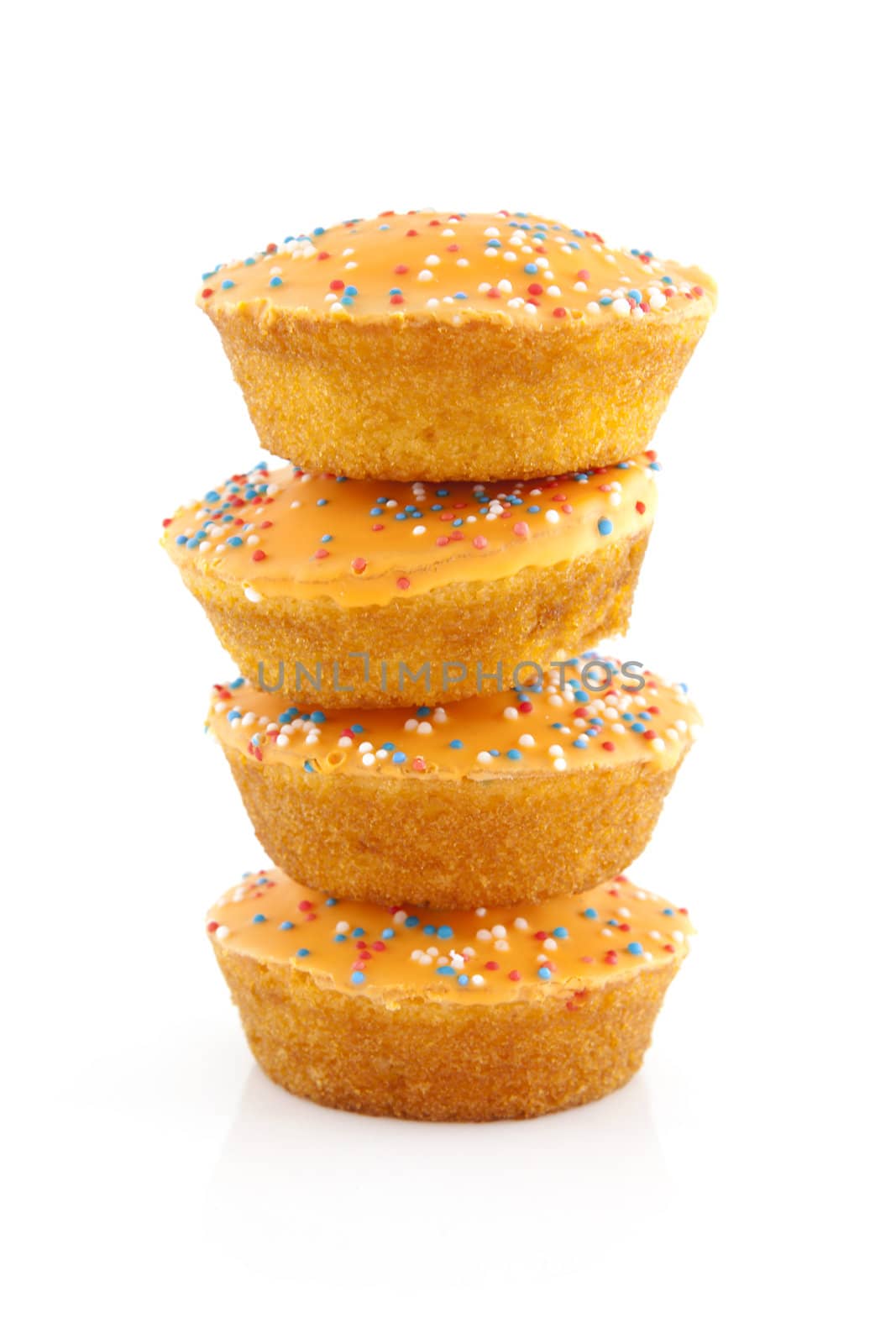 Pile big orange cake cookies for Dutch soccer with confetti over white background