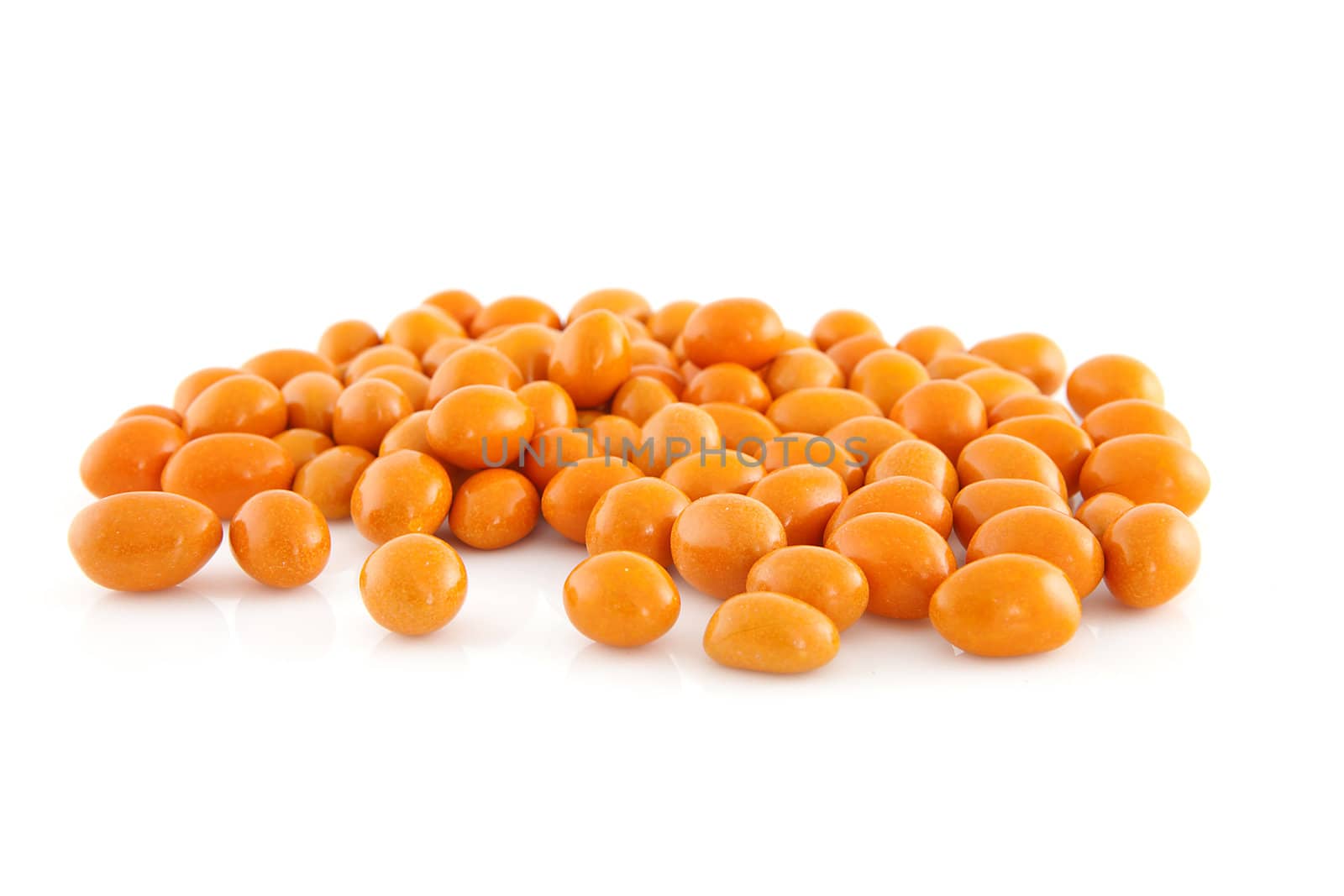 Orange peanuts isolated on white background