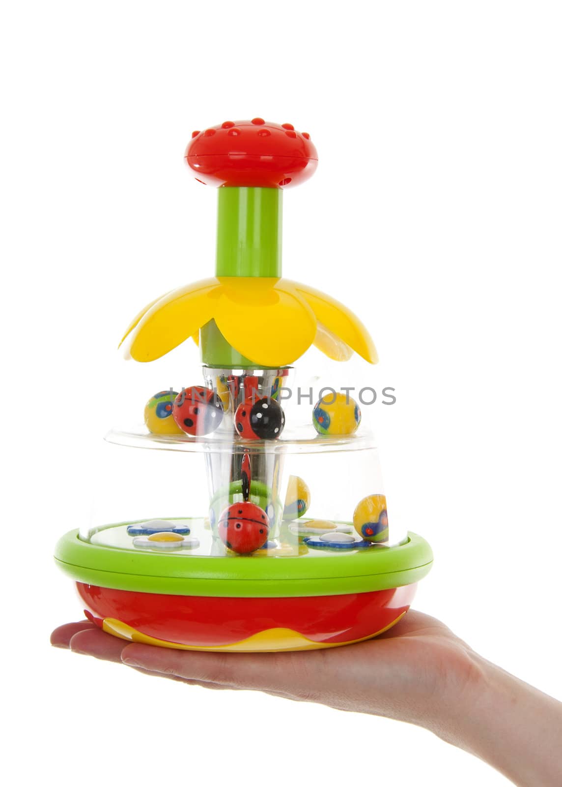 Hand with play toy over white background