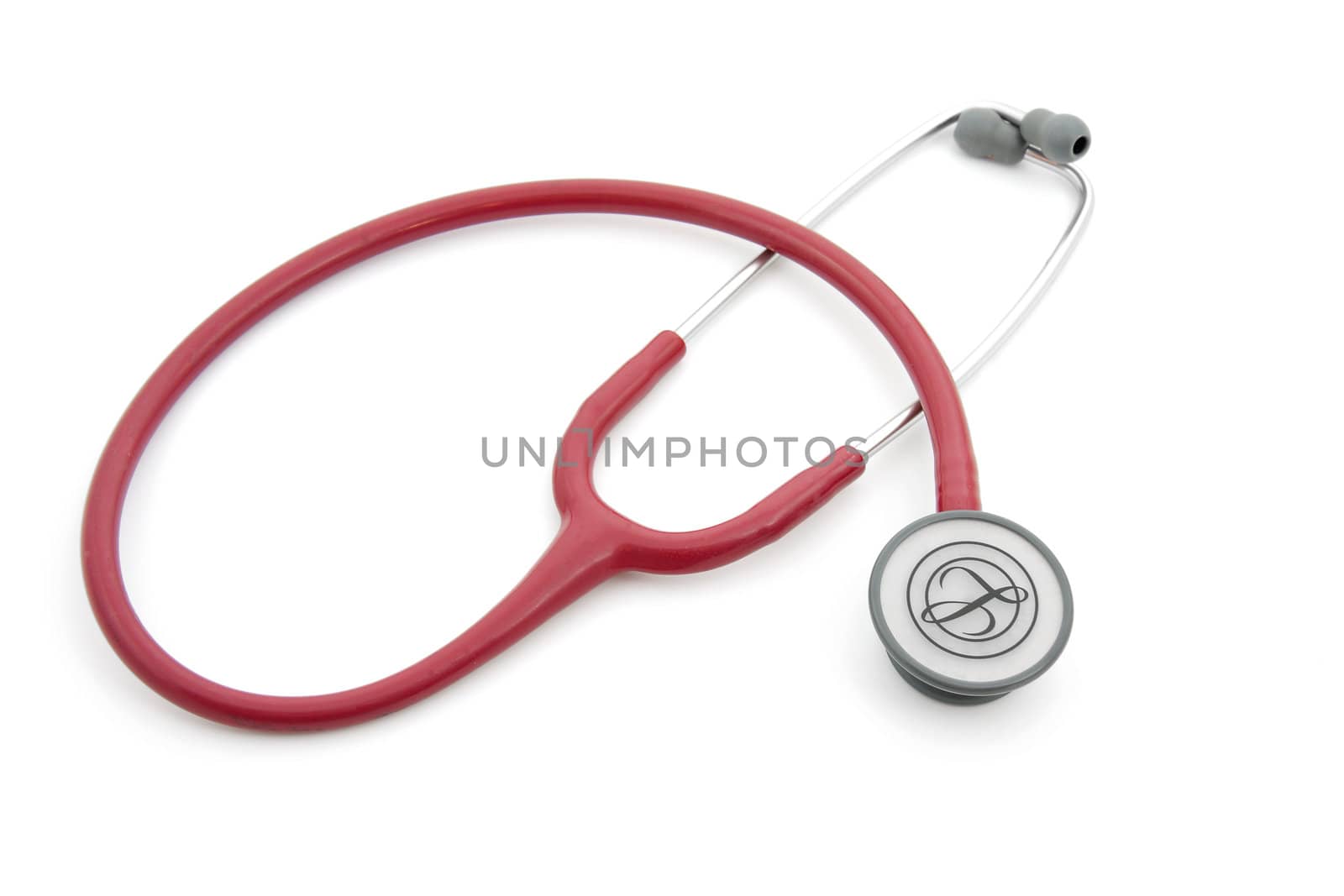 Red stethoscope isolated on white background
