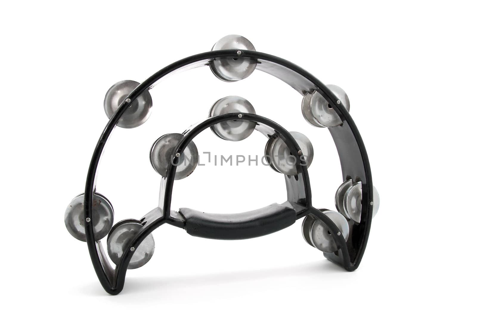 Old black tambourine instrument isolated on white background