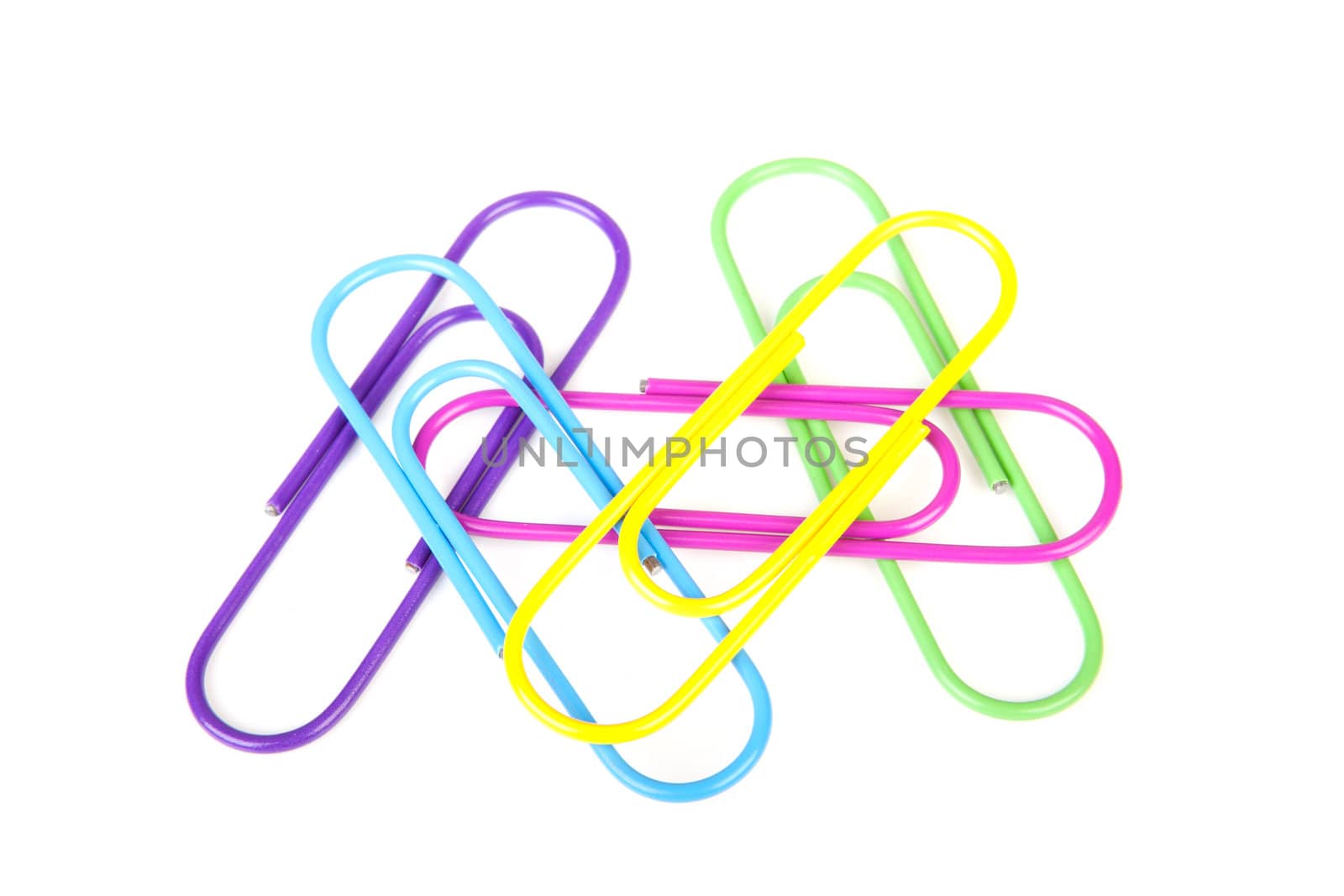 Five colorful paperclips isolated on white background