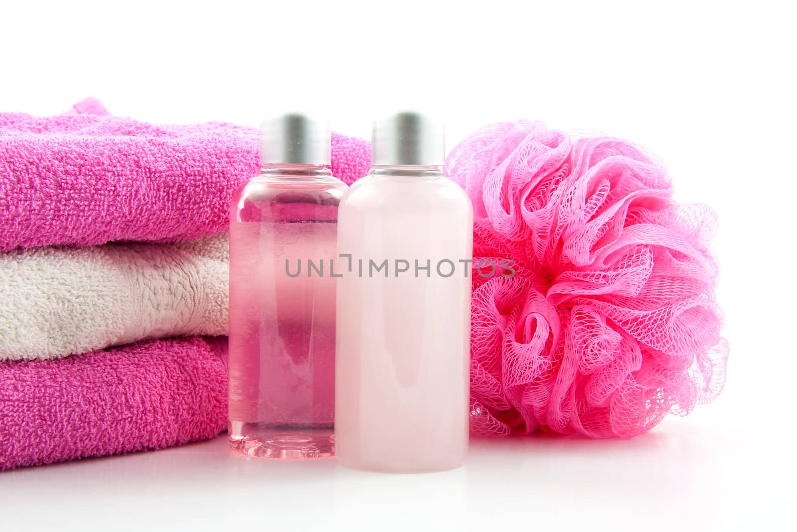 pink spa bathroom accessory on cane mat over white background