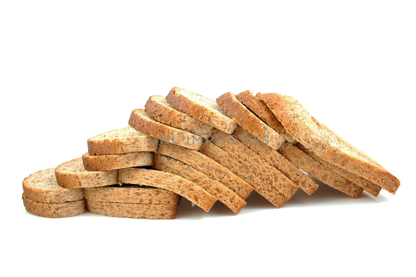Slices Dutch brown bread over white background
