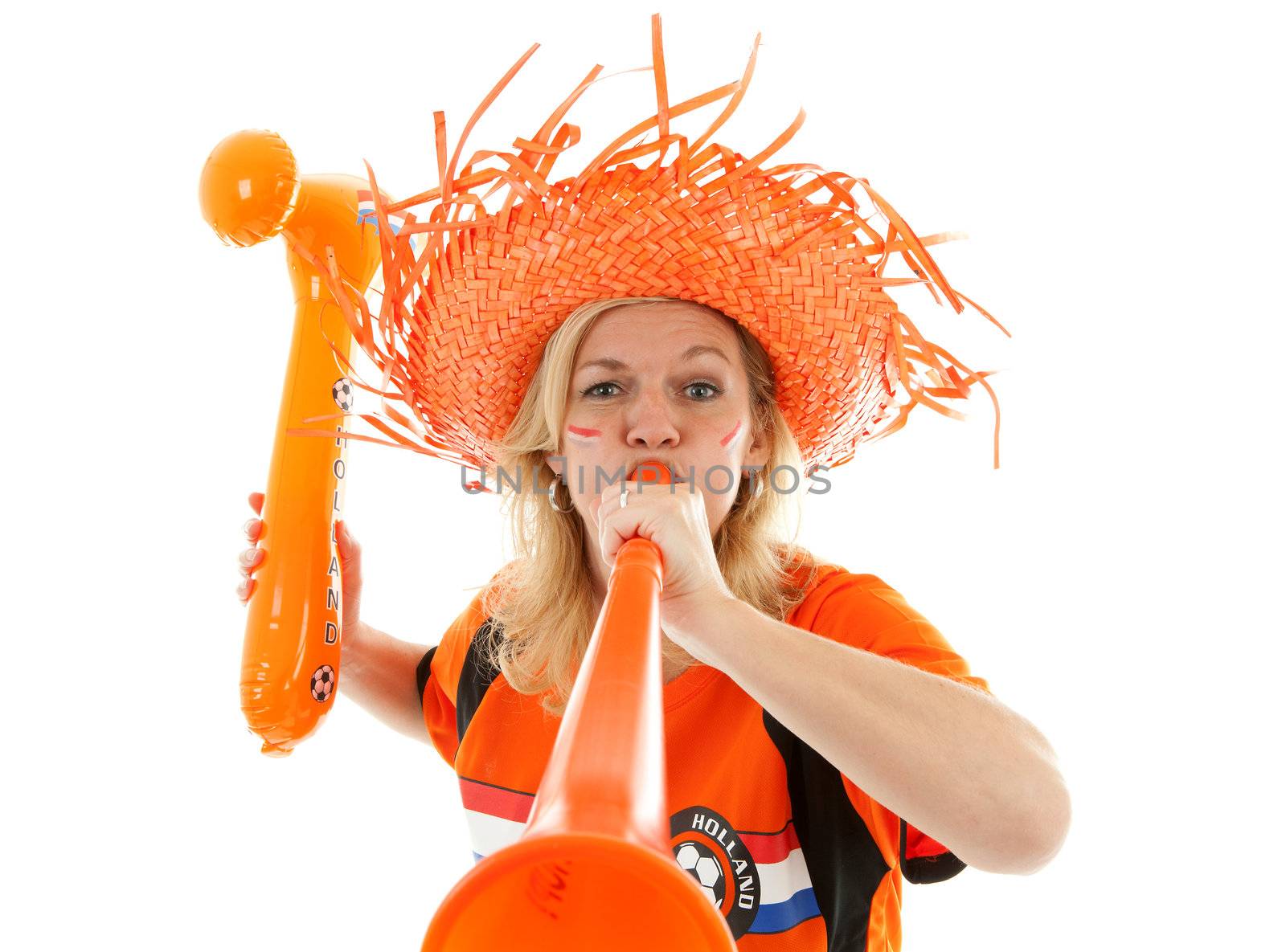 Female Dutch soccer supporter with orange plastic vuvuzela and blown up hammer over white background