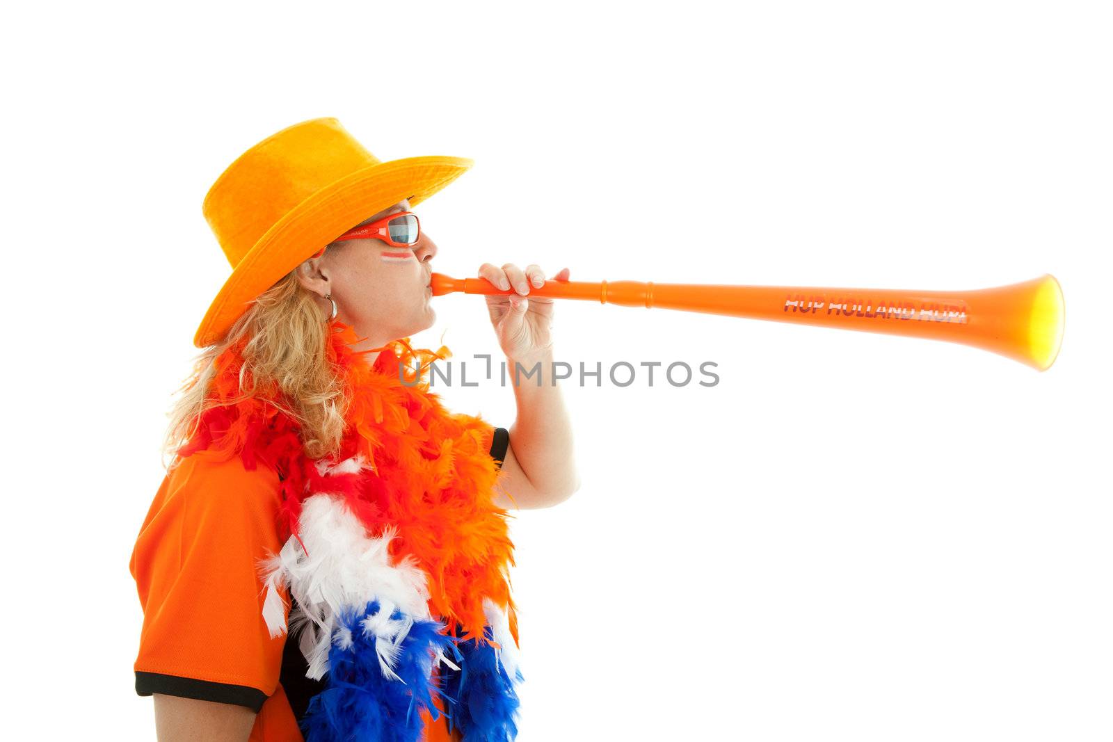 Female Dutch soccer supporter with orange plastic vuvuzela over white background