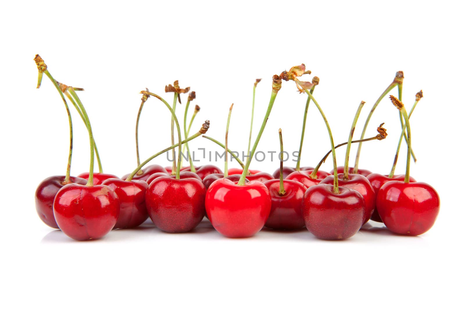 lots of fresh red cherries isolated on white background