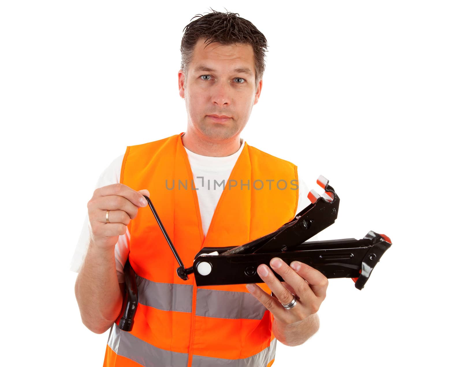 man in safety vest holding car breakdown jack over white background