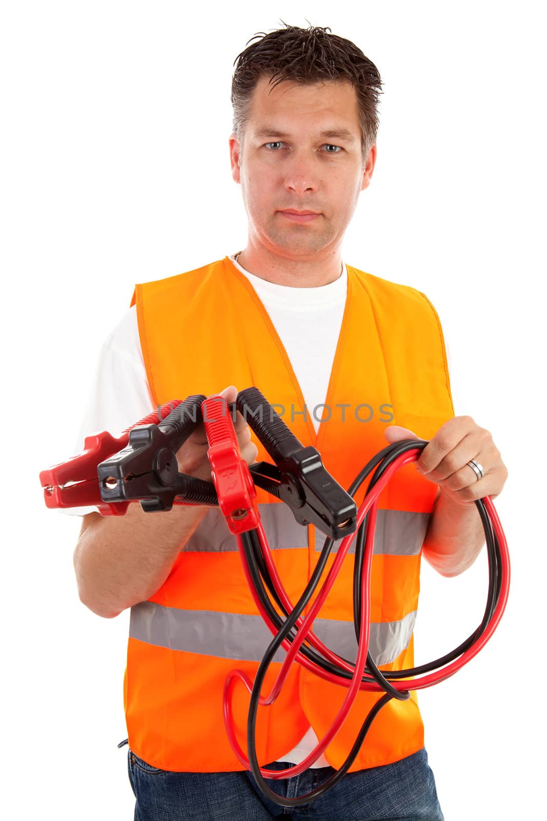 man in safety vest holding car jumper cables over white background