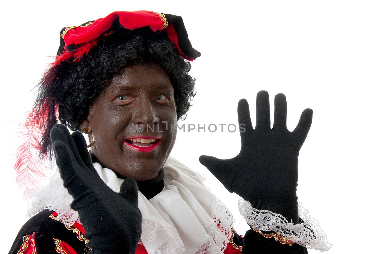 Happy Zwarte piet ( black pete) typical Dutch character part of a traditional event celebrating the birthday of  Sinterklaas in december over white background