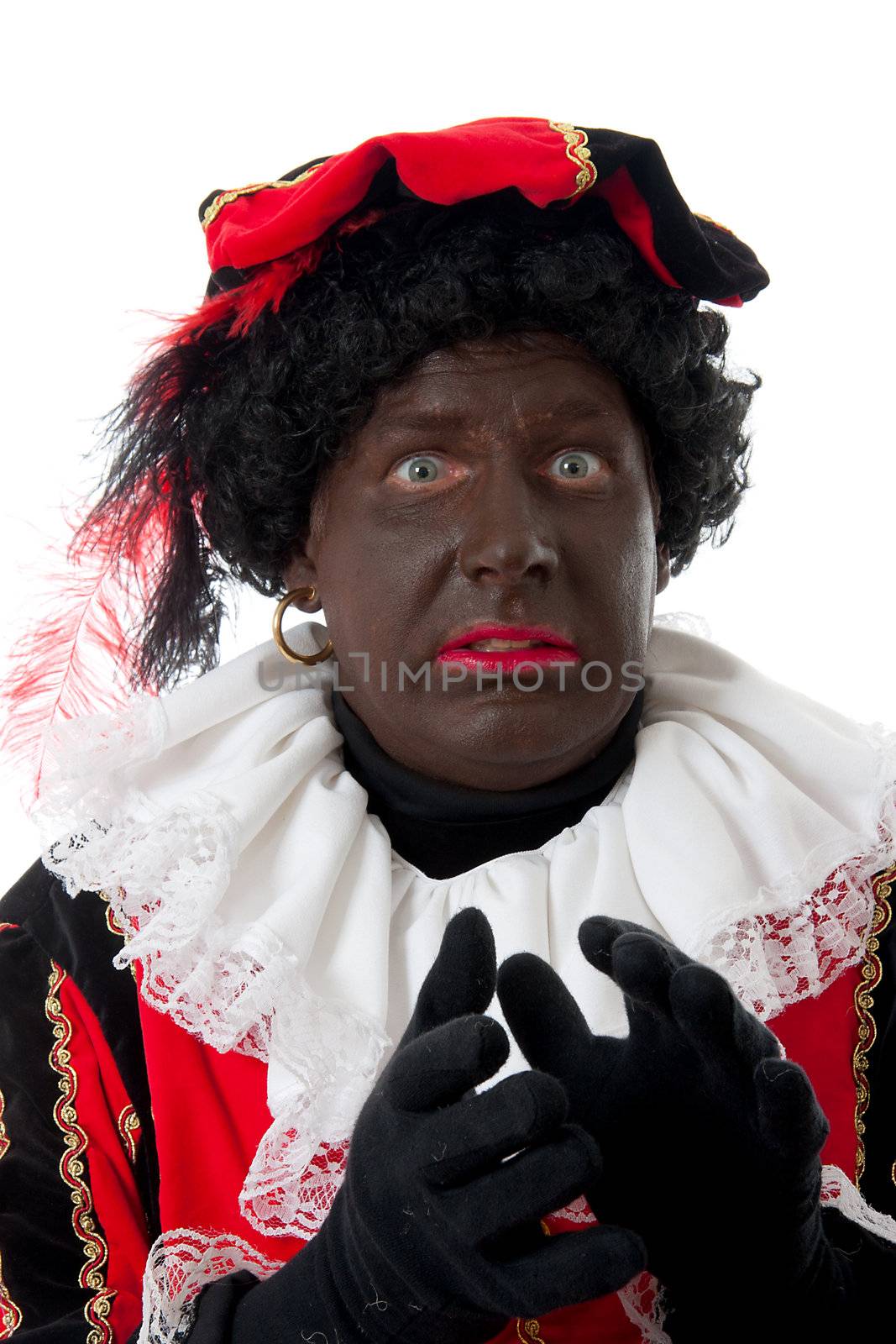 scared Zwarte piet ( black pete) typical Dutch character part of a traditional event celebrating the birthday of  Sinterklaas in december over white background
