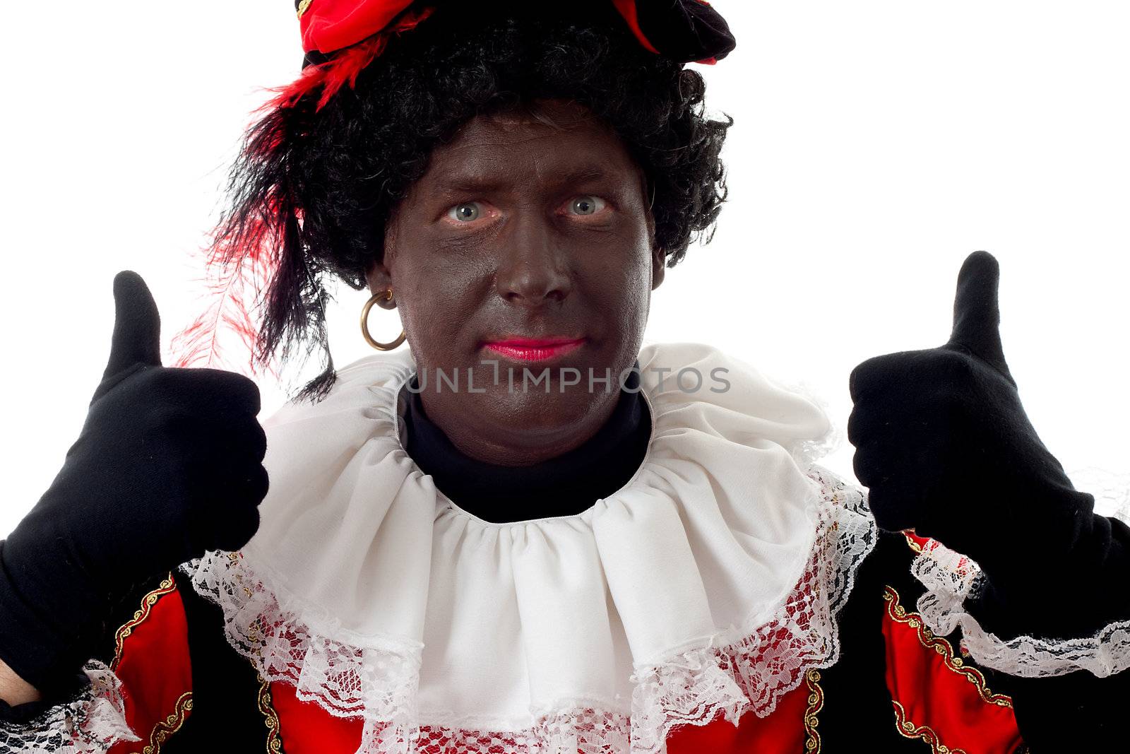 Happy Zwarte piet ( black pete) typical Dutch character part of a traditional event celebrating the birthday of  Sinterklaas in december over white background