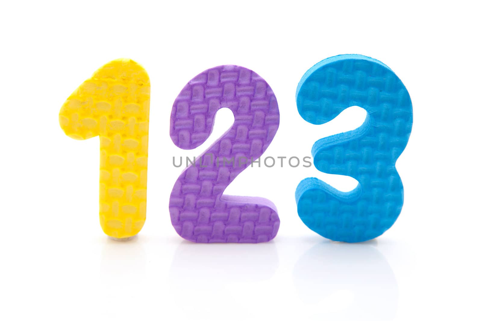 colorful foam figures 1 2 3 over white background