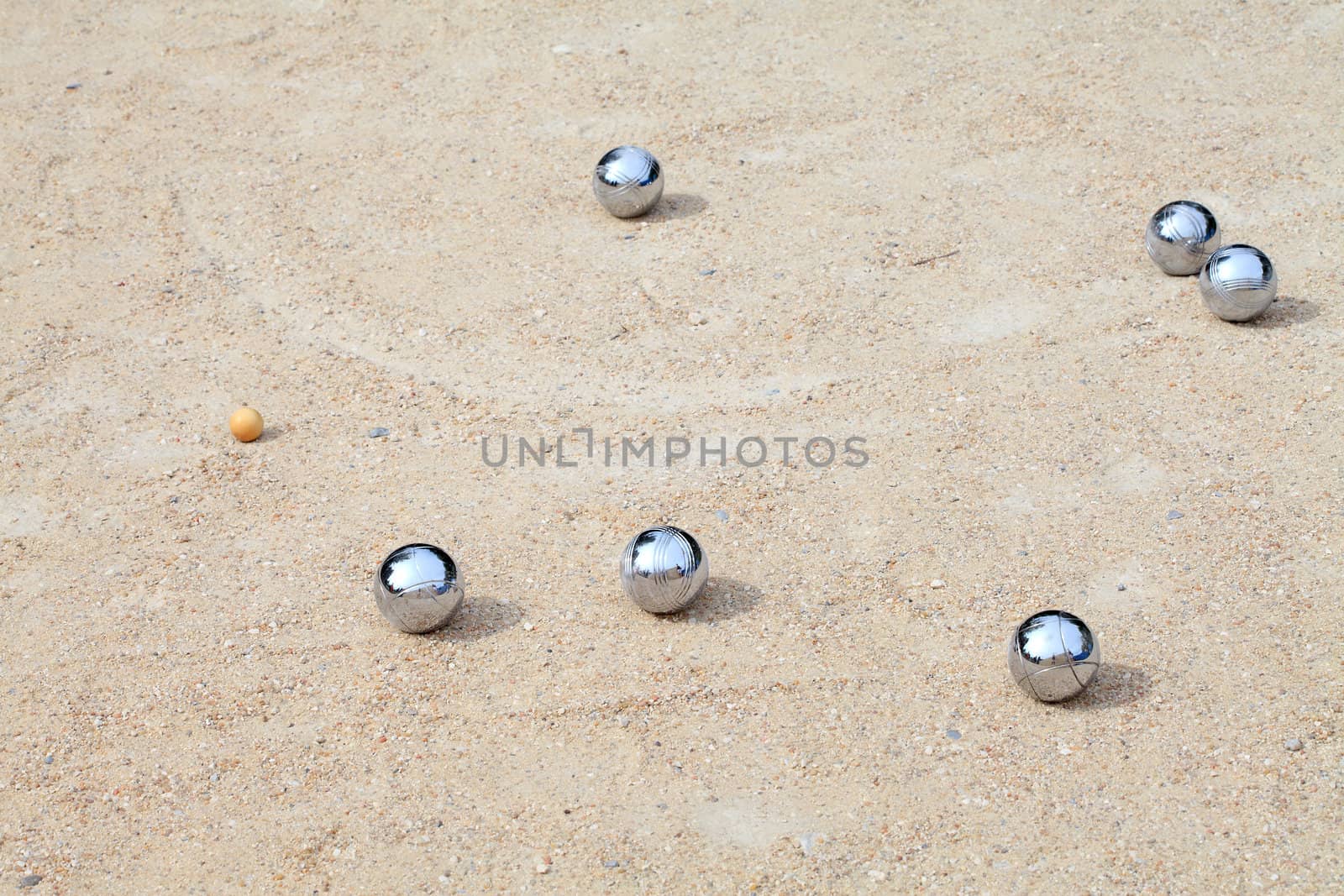 Game of jeu de boule, silvermetal  balls in sand. A french ball game