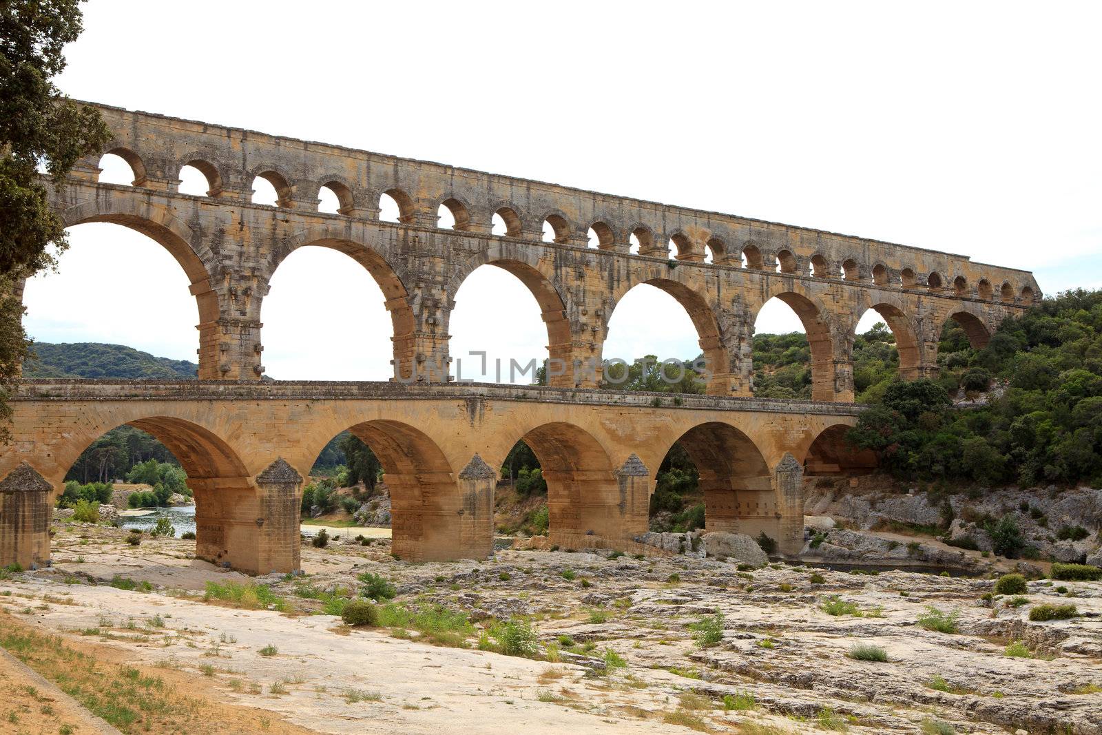 Scenic view of Roman built Pont du Gard aqueduct, Vers-Pont-du-Gard in South of France.
