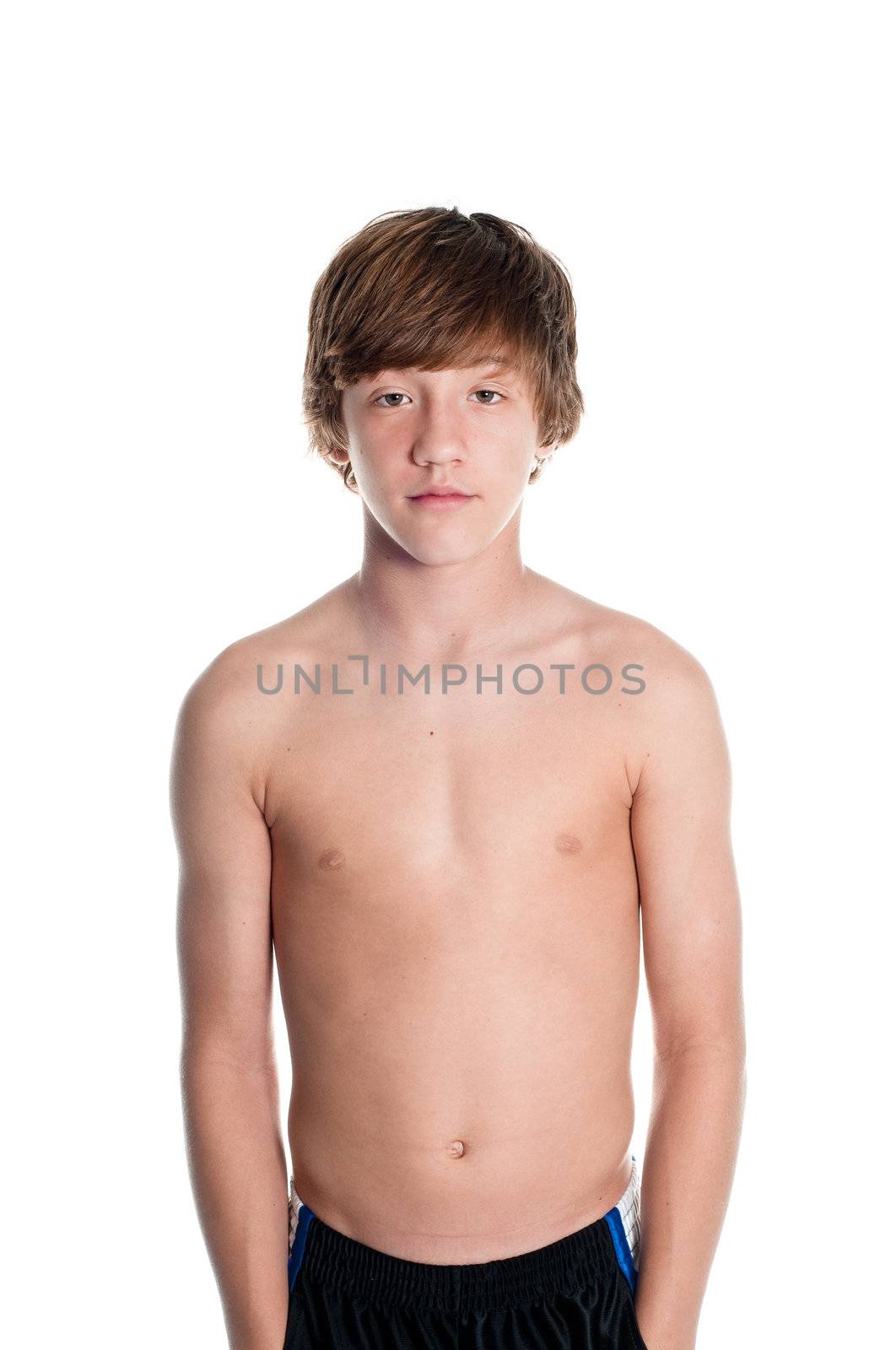 Young teen boy looking serious. Isolated on white.