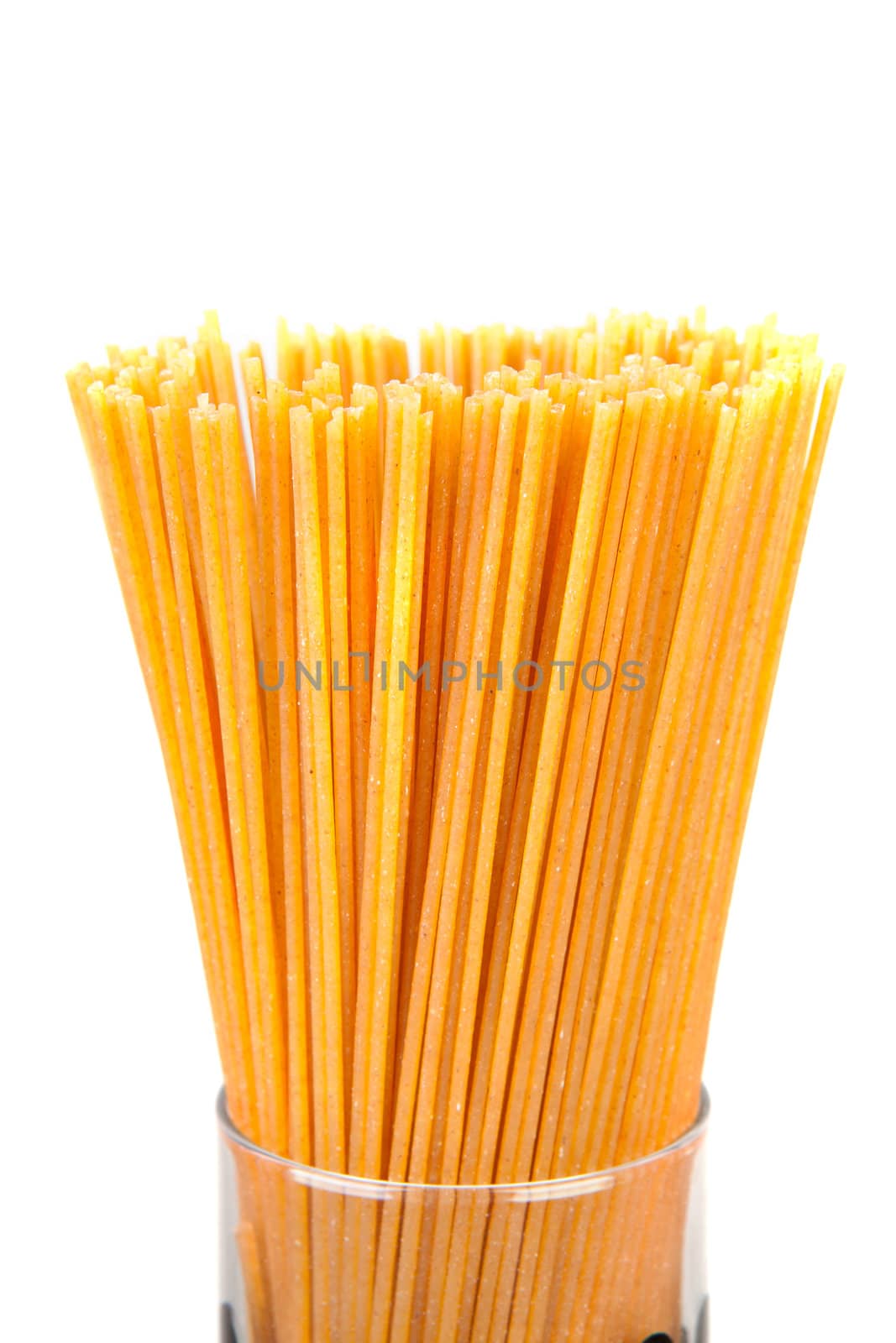 bundle of raw spaghetti over white background