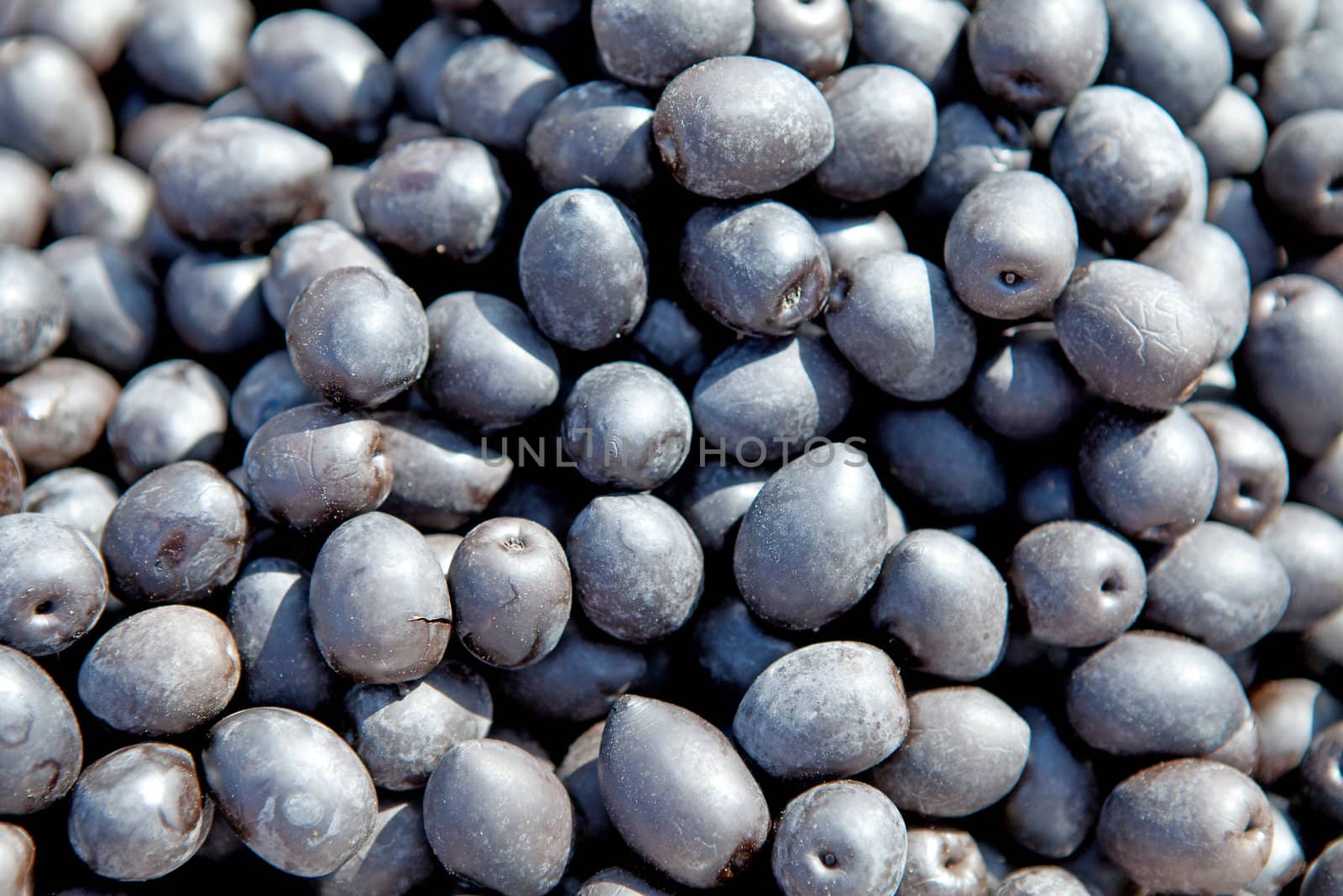 group of black olives can be used as background
