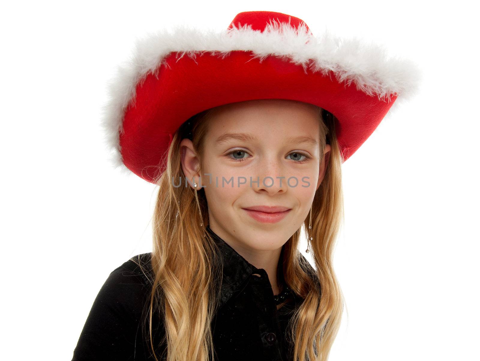 Girl with christmas hat is posing over white background