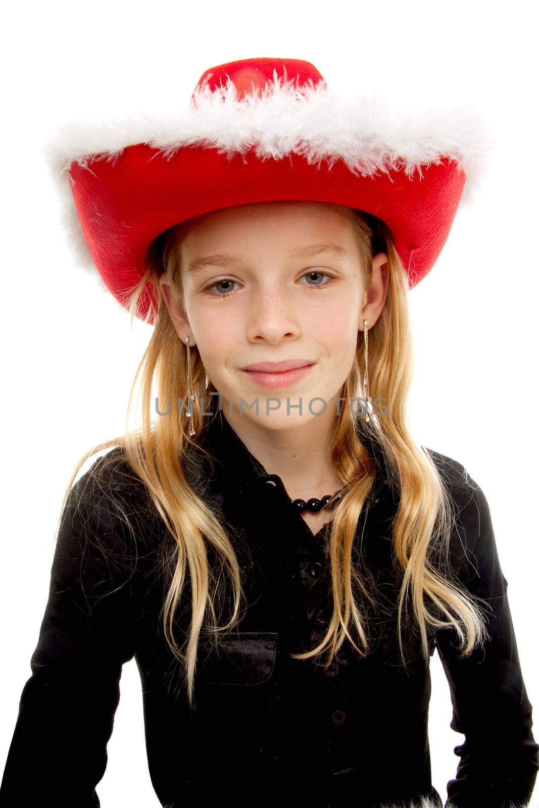 Girl with christmas hat is posing over white background
