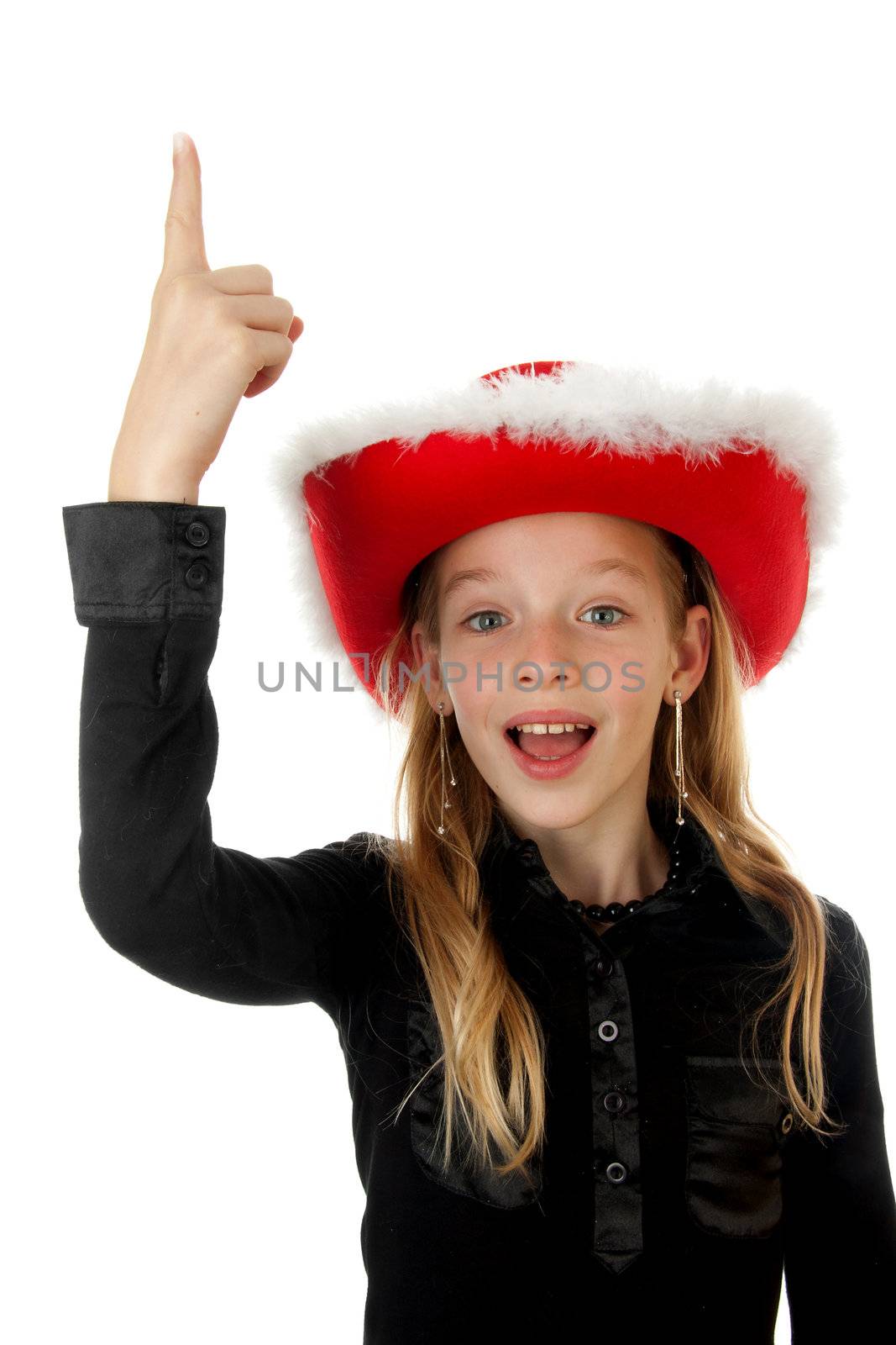 blonde girl with christmas hat over white background is pointing above her head to empty space for your text 
