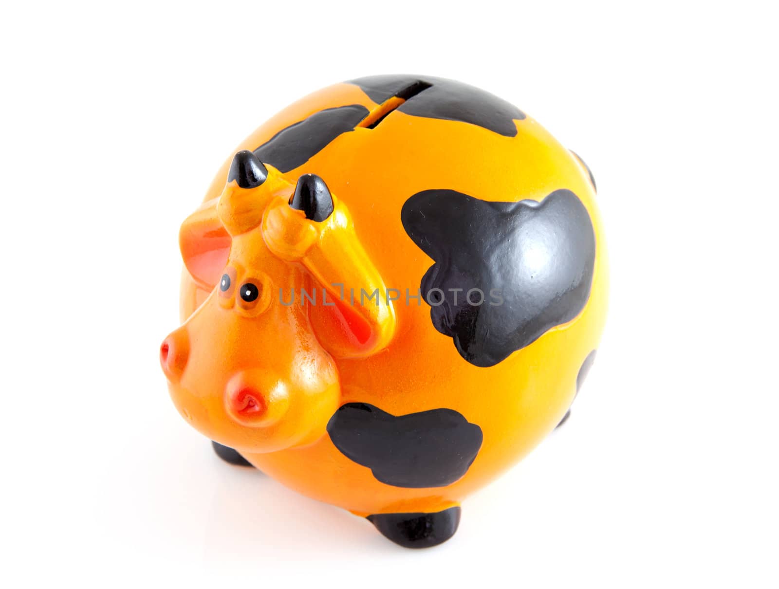 piggy bank in the shape of orange cow isolated on white background