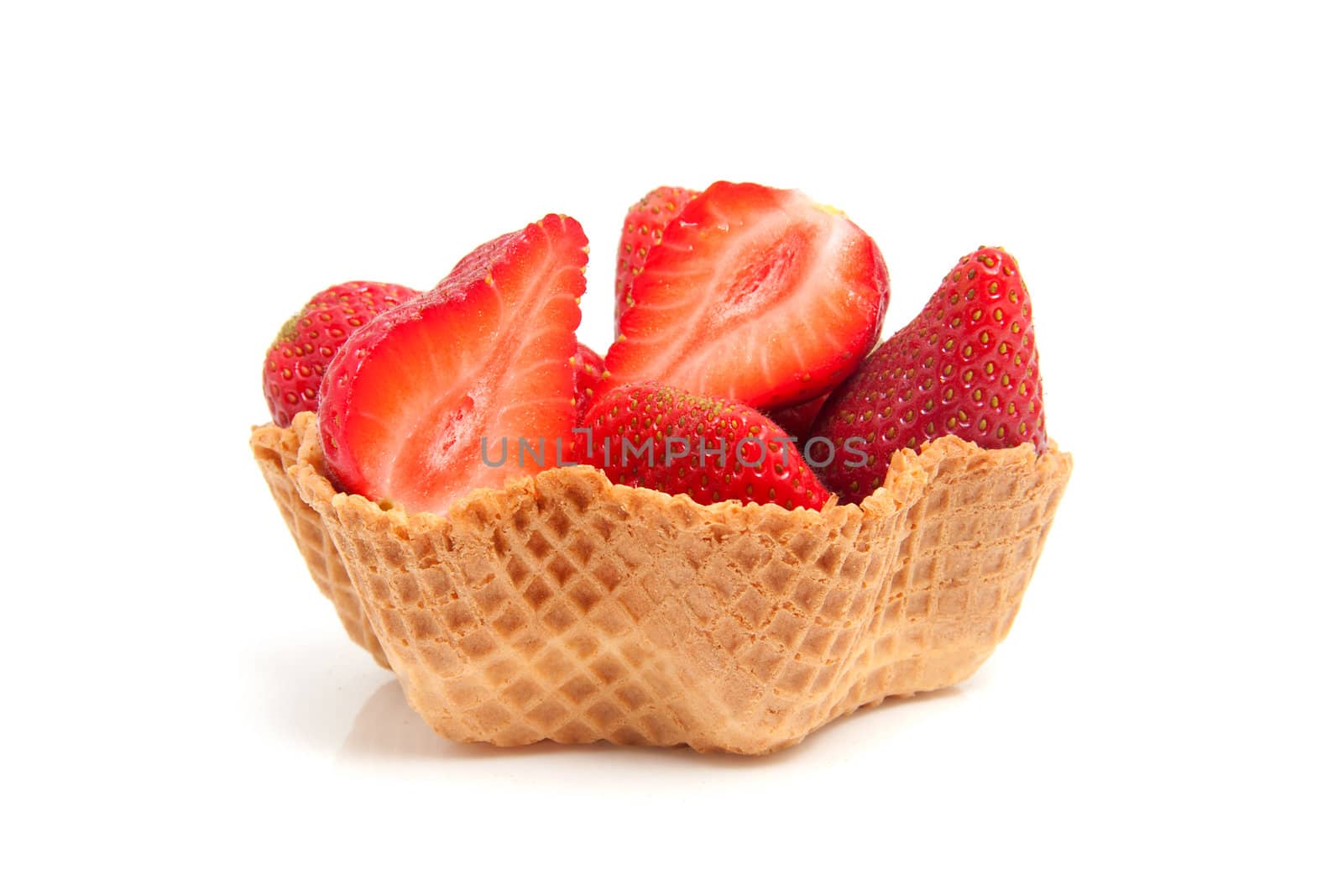 delicious dessert made out of cookie cup filled with fresh strawberry over white background