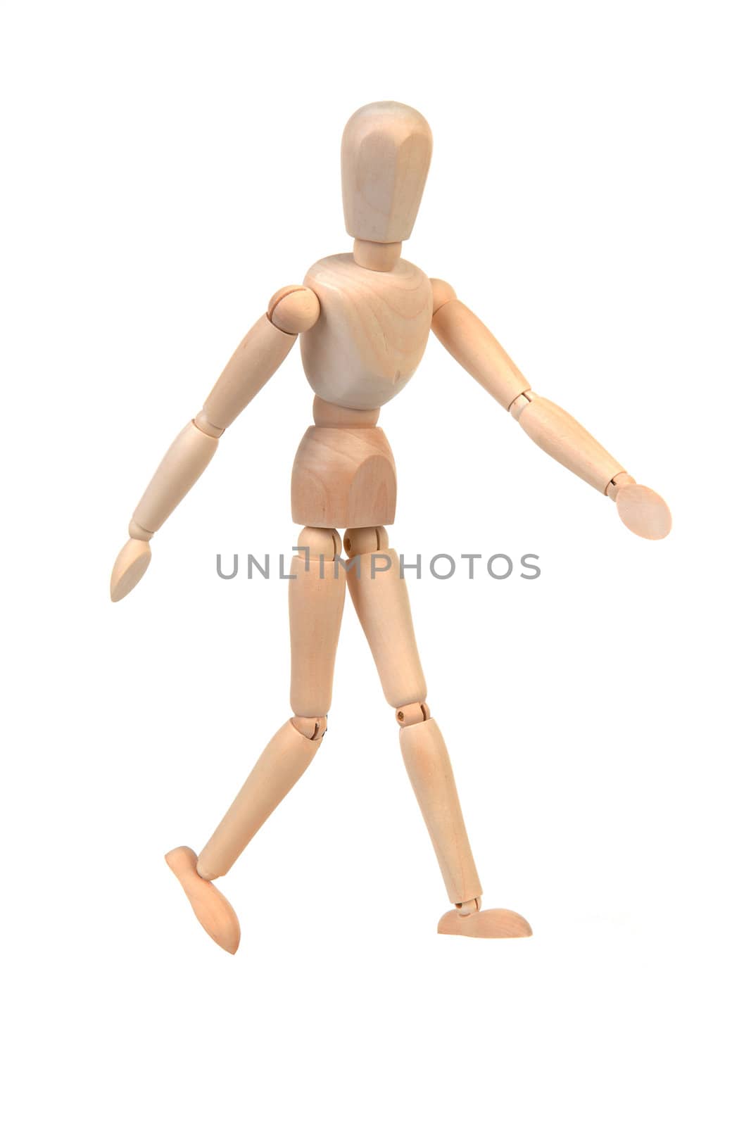 flexible wooden doll is walking over white background