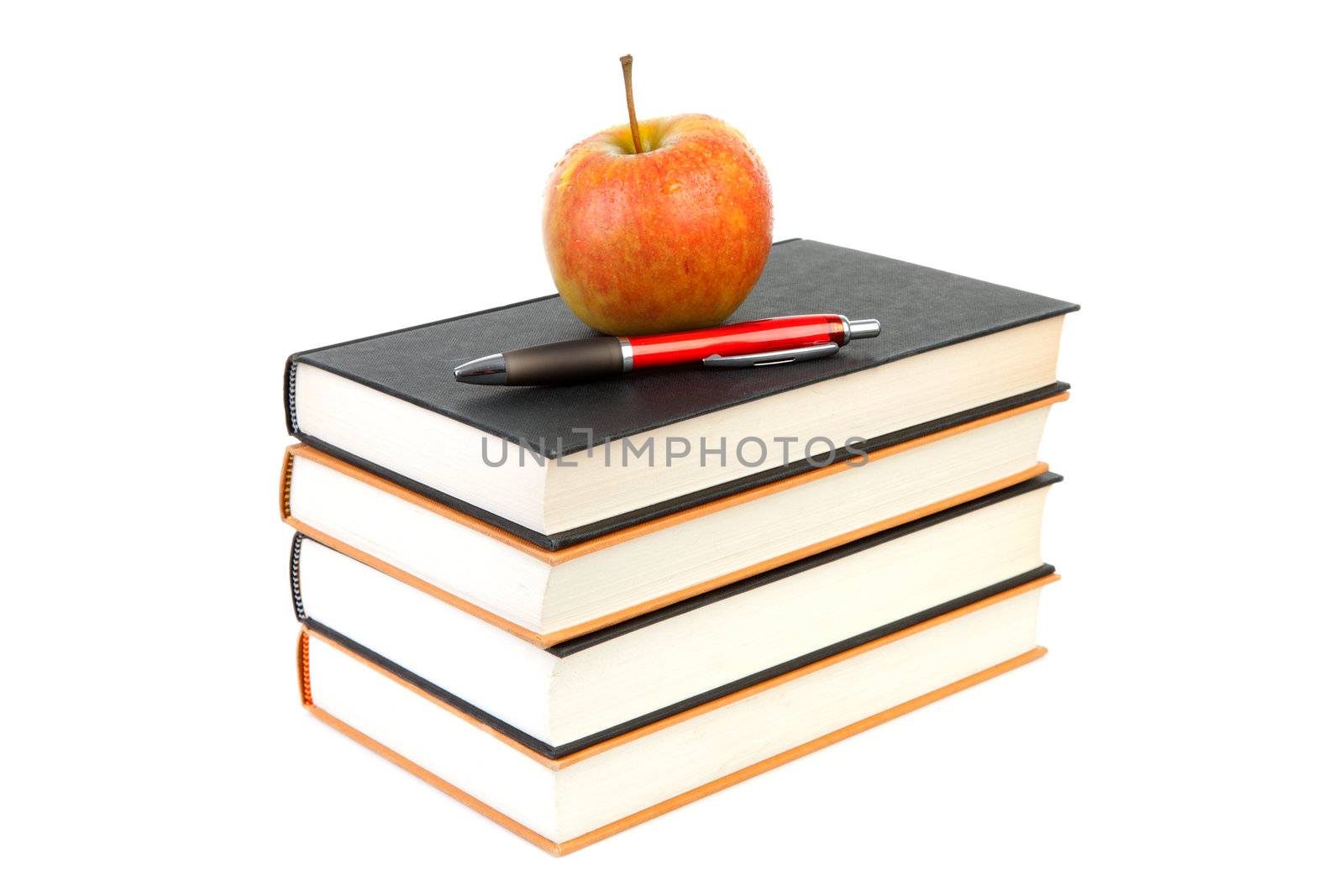 back to school: stack of books with apple and pen on top over white background