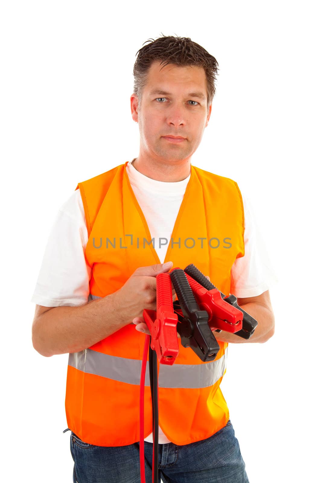 man in safety vest holding car jumper cables over white background